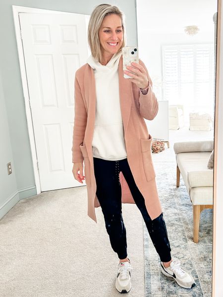 This comfortable and casual combo has quickly become my favorite Fall outfit and uniform for running errands.

Wearing a size small in everything. 
 
Coatigan is in color Khaki from Amazon.
Neutral Hoodie is in color Cream from Abercombie & Fitch

Athleisure outfit, Zella Live In Joggers, black Joggers, Essential Popover Hoodie, Cream Hoodie, neutral sneakers, Nike Waffle Debut Shoes, Neutral casual sneaker. Fashion sneaker. 
Fall fashion, Fall outfit, casual Fall style. 
#ootd #falloutfit

#LTKover40 #LTKfindsunder50 #LTKstyletip