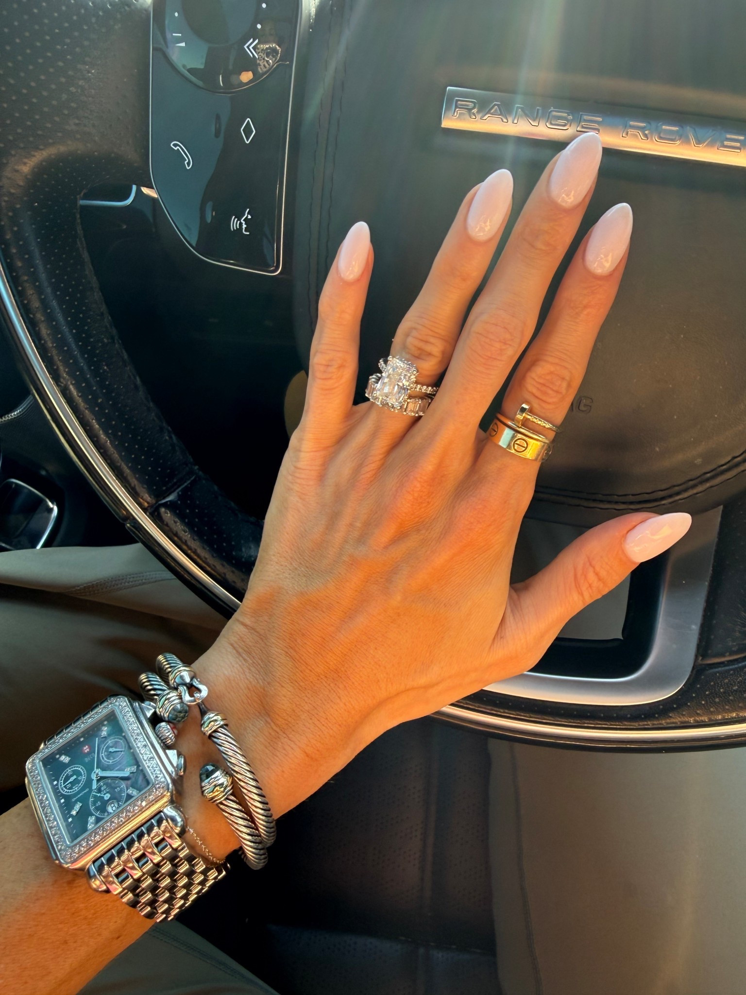 Nail color is let’s be friends by OPI. Linking watch and bracelets . Gold rings are Cartier 