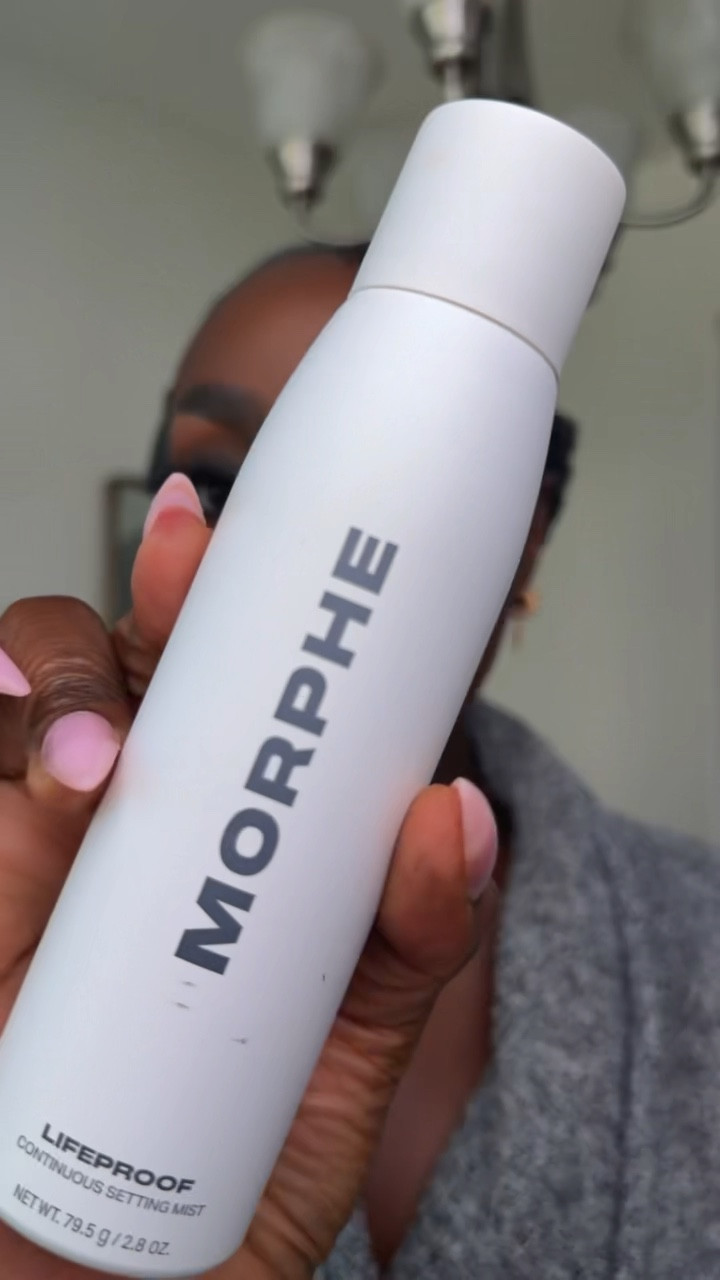 Using the MORPHE lifeproof continuous setting mist to set my face.
