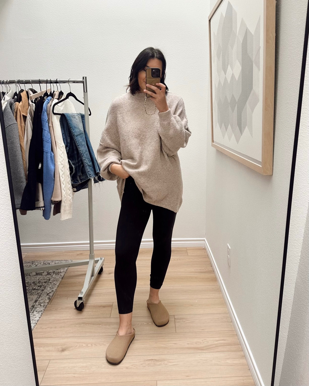 I'm in the medium of the sweater -- it runs big! 

I wear an 8 in the leggings. Clogs run TTS! 

 