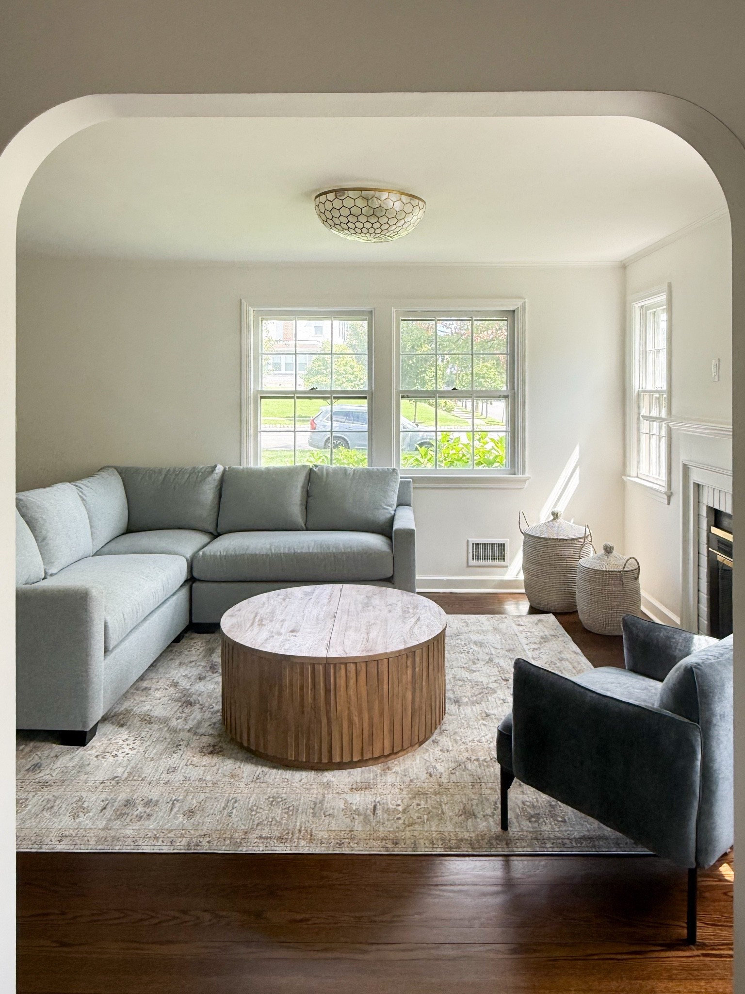 One of my favorite recent room transformations! LOVE this storage coffee table (super kid-friendly — great for a smaller space!!) and this sectional is the prettiest shade of blue. Used one of my favorite rugs and arm chairs too!!

#LTKHome #LTKdayinmylife #LTKSaleAlert