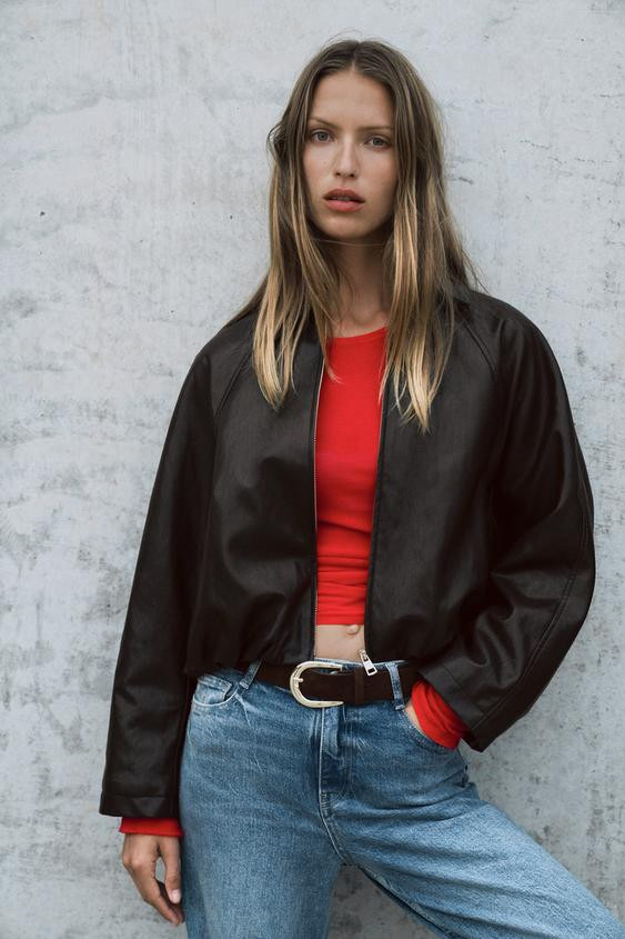 High collar jacket. Long sleeves finished in cuffs with shoulder tabs. Side pockets. Contrasting ... | Zara US
