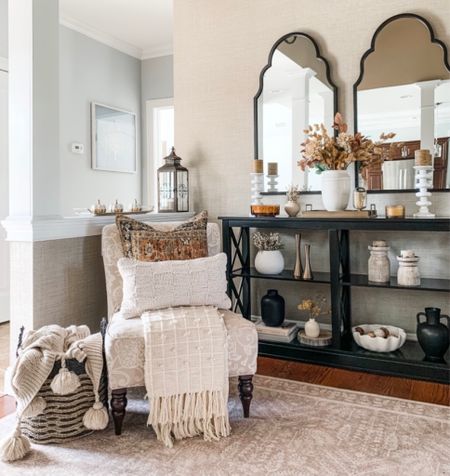 Fall console table styling. neutral rug on sale, fall throw pillows, cozy tasseled throw blanket, fall florals, fall fragrant candles, brass tray, off white vase, candleholders, black vases. Rugs Direct, Amazon, Target, Kirkland’s Home, Pottery Barn. 


#LTKSeasonal #LTKhome #LTKunder50