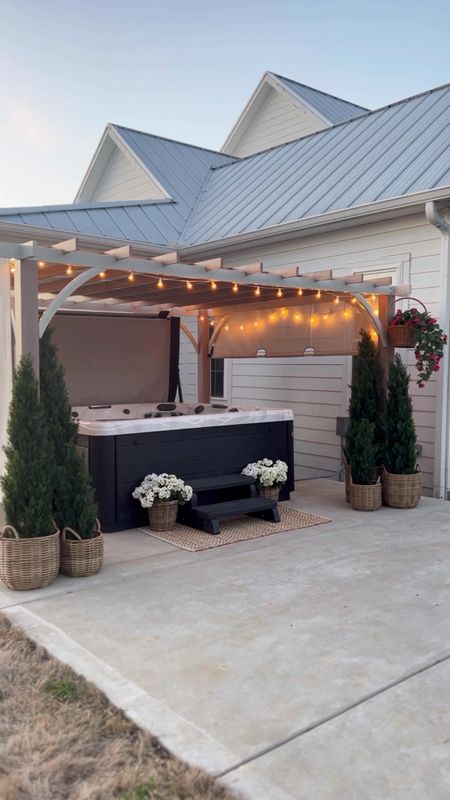 Hot tub and pergola outdoor patio space outdoor living home decor faux artificial flowers and trees string lighting baskets planters jute scatter rug pergola gazebo pool furniture spa jacuzzi 

#LTKSeasonal #LTKhome #LTKFind