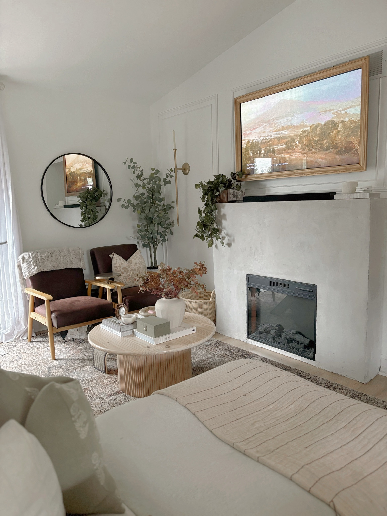 Small but cozy living room set up. Switched out the summer floras for Fall florals.
I made the coffee table, fire place, the tv frame and added the wall mouldings. The little extra details make all the difference! 

#LTKHome