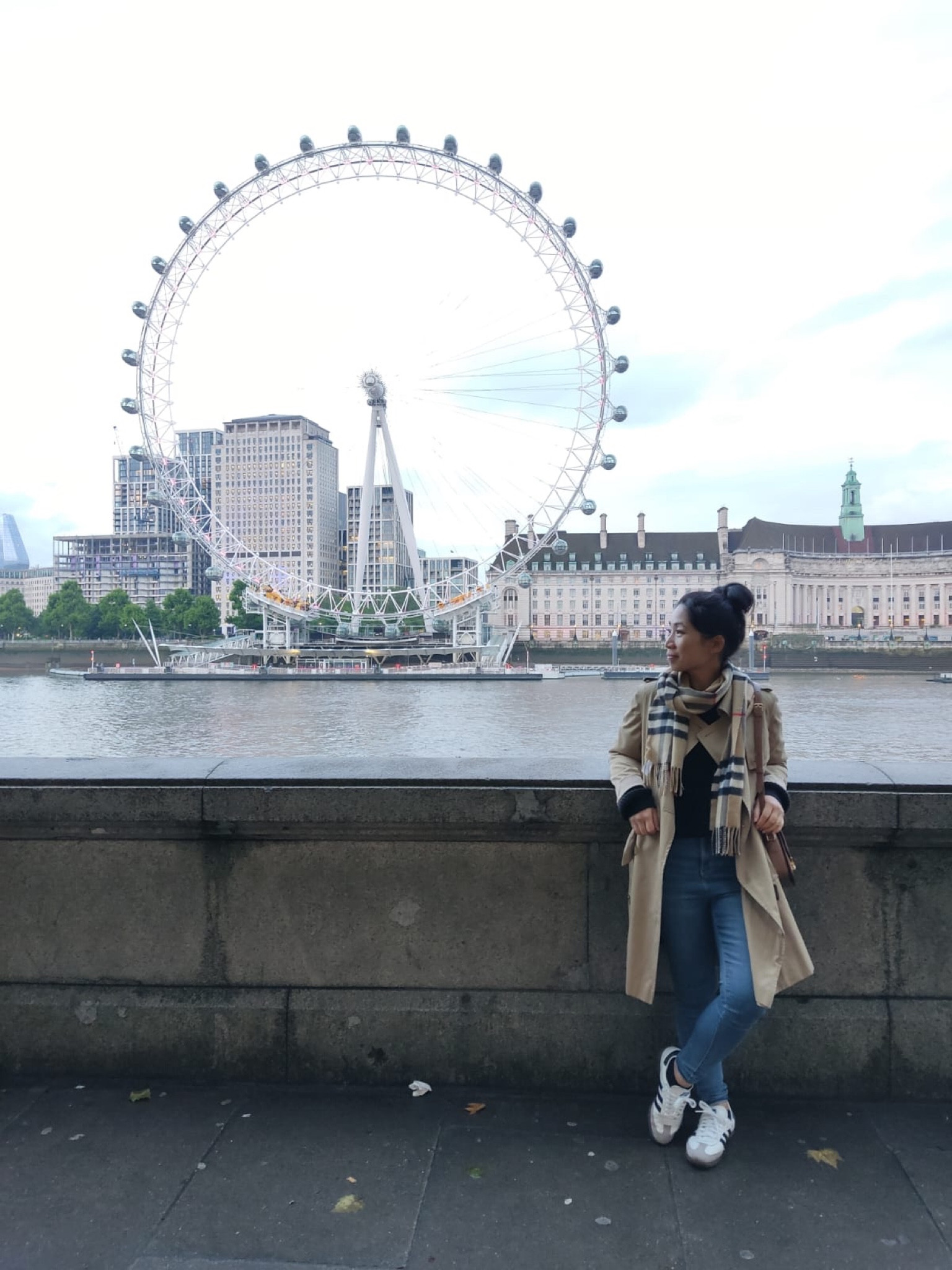 What to wear when visiting London in May? Comfortable walking shoes for >20K steps per day of sightseeing and rain-proof trench! 🌧️👟

My outfit: 
//Miss Shop organic 100% cotton sweater (xs) from Myer. 

//Skinny jeans (old) from Kmart.  

//M&S trench coat sz Petite 6 (old season; new season colour appears slightly lighter). Previously tried on regular sz 6 and found petite better fit. 

//Burberry checked scarf. 

//Crossbody bag: Celine Teen Triomphe. 

//Adidas OG Samba EU 36.5 (US men’s 4.5, UK 4). I took half a size up from my usual as the EU36 felt just a smidge right in the toes and it’s often good to have a bit of wriggle room for toes when doing lots of walking. Would recommend pairing with slightly longer socks on your first wear as I got  blisters above my heels when worn with no show socks but no issues after second outing. 

#LTKaustralia #LTKstyletip #LTKtravel