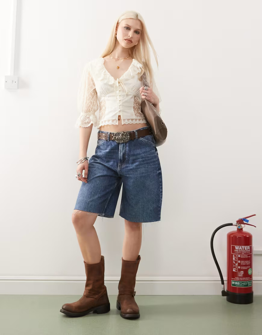 Reclaimed Vintage low rise baggy denim jorts in mid blue wash | ASOS (Global)