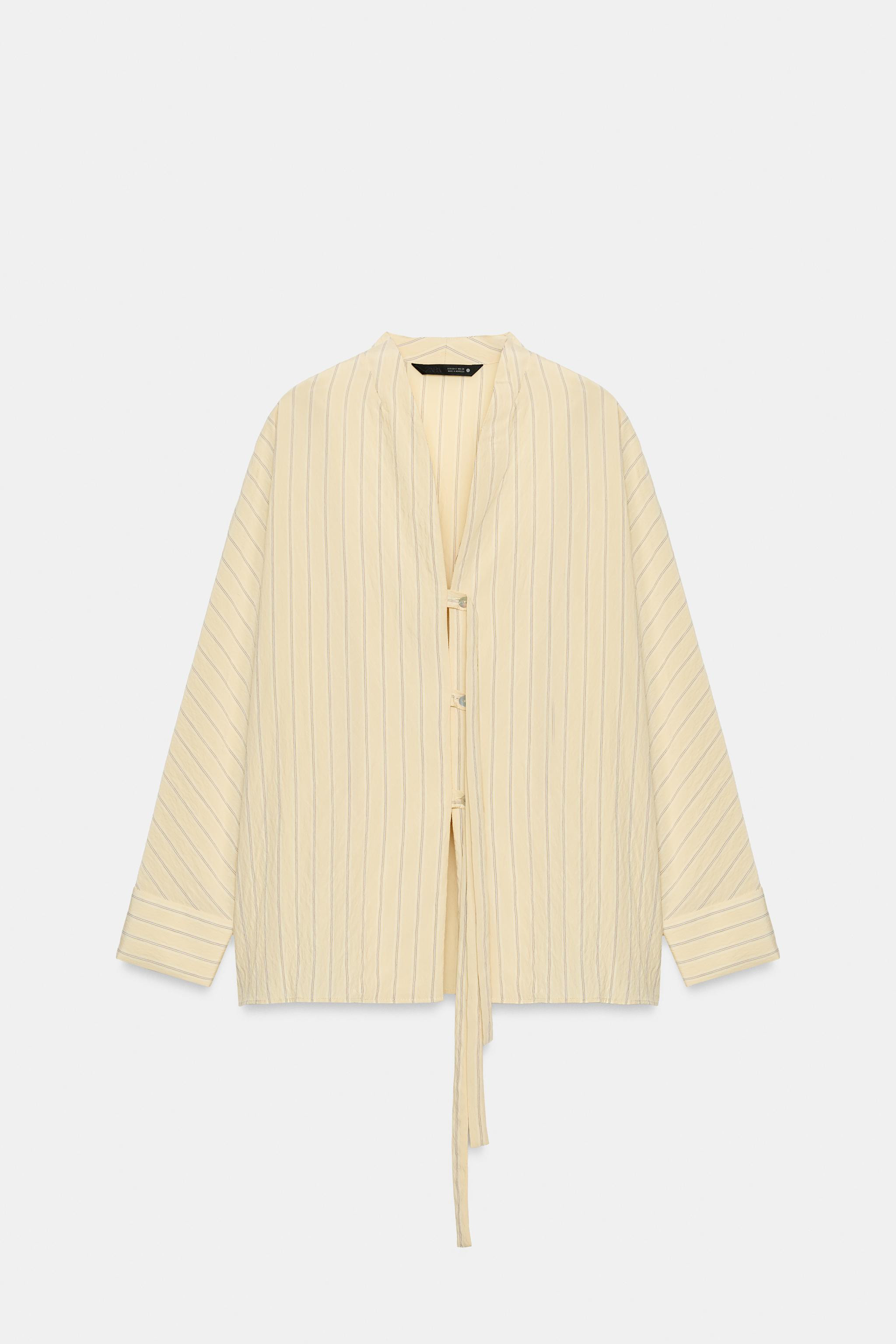 Model height: 179 cmZARA WOMAN COLLECTIONShirt made from a viscose blend yarn. Featuring a v-neck... | Zara UK