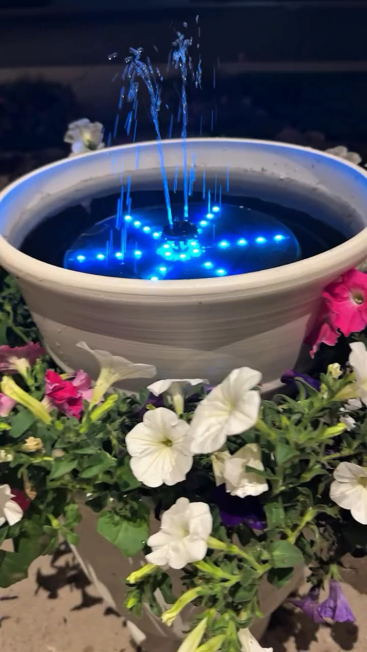 The secret to an elevated garden? A Diy solar water fountain planter! ⛲️🪴It’s not about the size of the space. it’s about the quality of the elements. I replaced the standard patio clutter with this solar water feature. Clean lines, organic sound, and zero maintenance—the hallmark of a truly well-designed outdoor room. Your patio should be an extension of your living space not an afterthought. 
🌱Comment FOUNTAIN for the ljnk to everything!!
🌸Follow me @snoe.aschman for more! 
Set the Base: Place your large planter where you want it.
Create a Riser: Turn an empty plastic pot upside down and place it in the center of the large planter to act as a hidden pedestal.
Add the Second Tier: Place your smaller planter on top of that upside-down pot.
Plant the Garden: Fill the empty space around the center pedestal with potting soil and add your flowers.
Add Water & Fountain: Fill the top planter with water, place your solar fountain inside, and you’re done!

Outdoor room. Garden design. Solar water fountain. Diy water fountain. Planter. Elevated Home. Patio. Front porch. Home decor. Garden. diy. Crafty mom. Plant mom. Plant lady. Modern Gardening. Water feature. Curb appeal. Amazon finds.

#LTKSeasonal #LTKHome