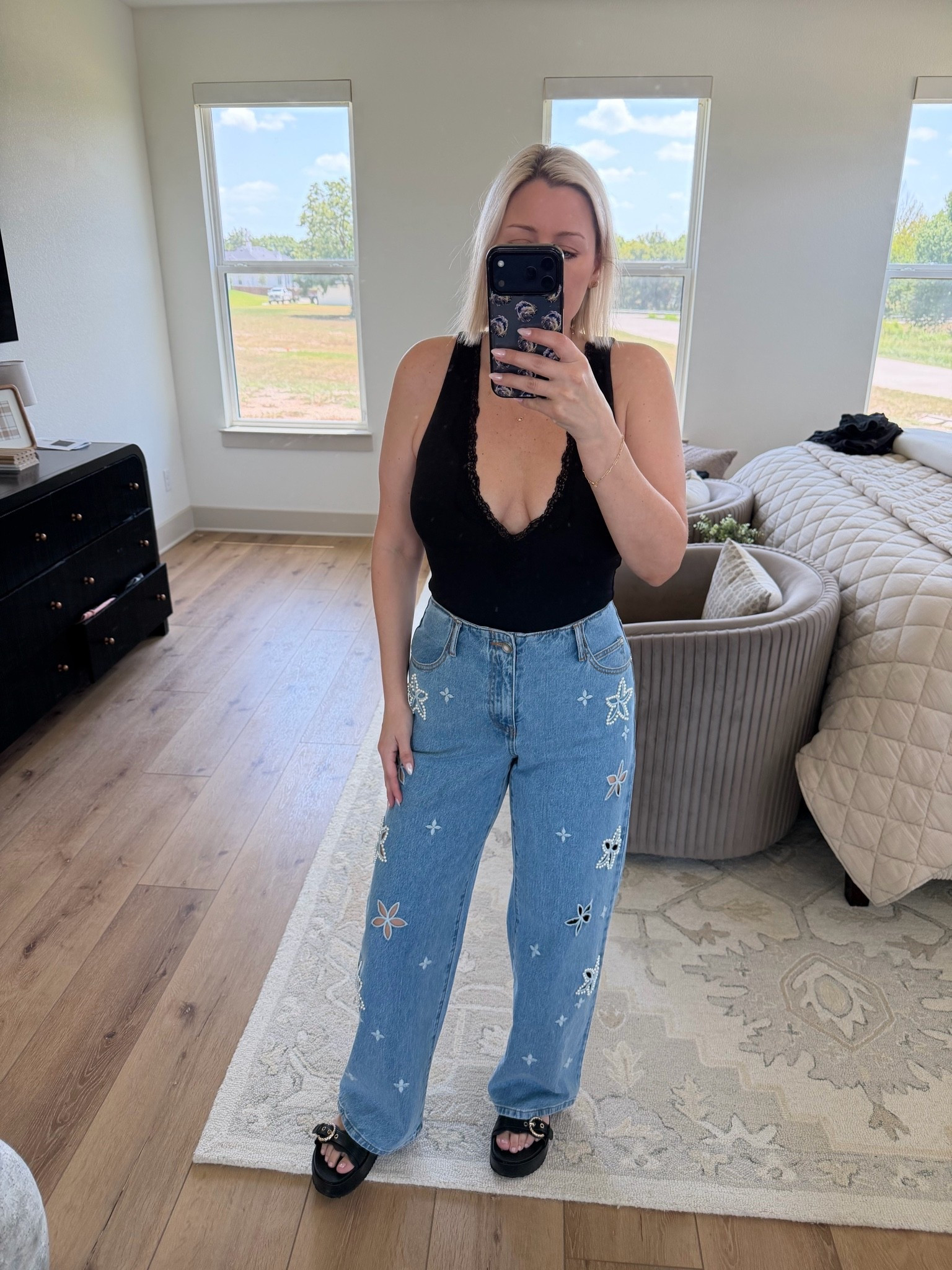 Obsessed with these jeans and this lace trimmed low cut bodysuit 🤌🏼 also, wearing my go-to platform sandals that are so comfy!
