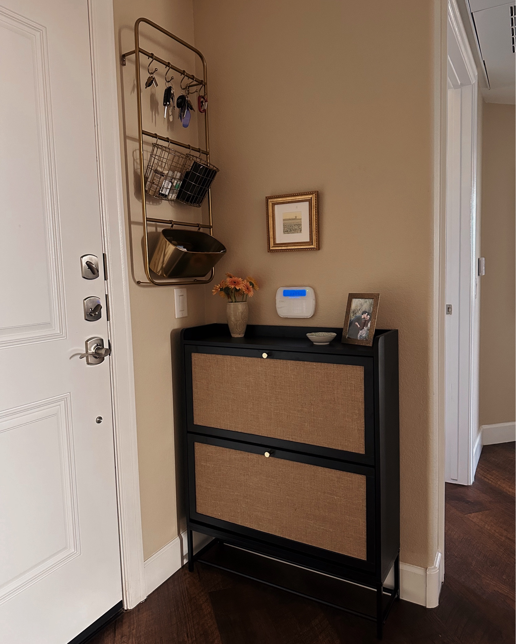 Obsessed with our new shoe storage cabinet! Love how organized our entryway is now and that all the shoes have a dedicated spot ✨ each drawer has 2 layers and this cabinet can hold about 16 pairs of shoes, with even more on the bottom rung! 

#LTKHome