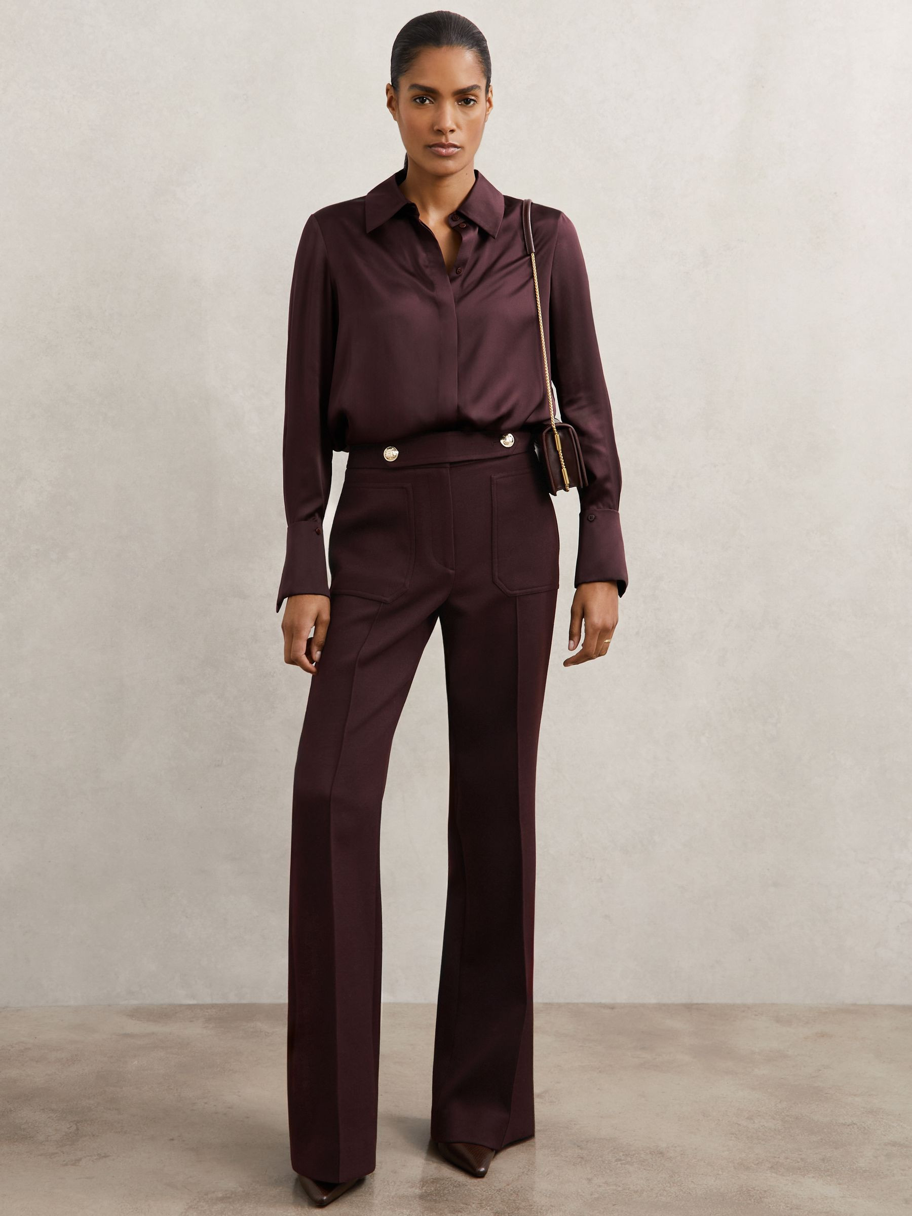 Petite Twill Button-Tab Flared Trousers With Wool in Burgundy | Reiss UK