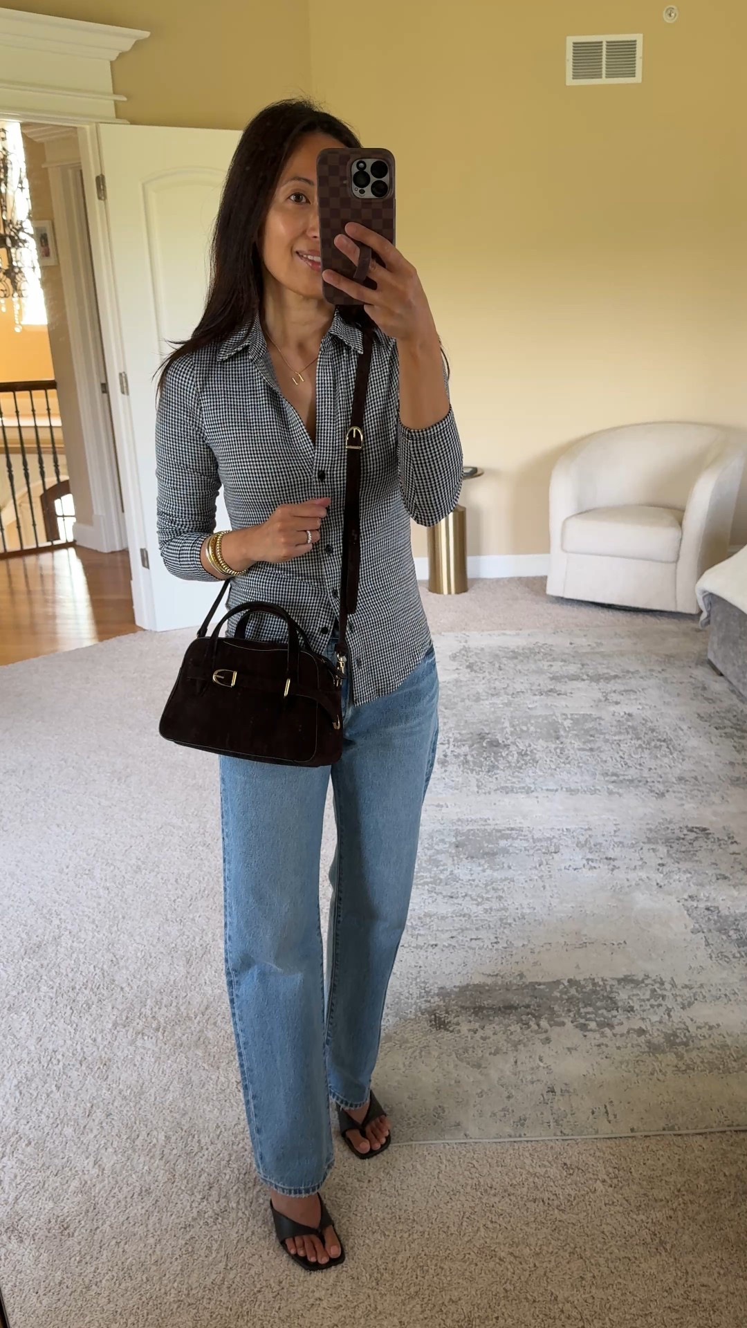 Casual chic Fall outfit idea. I’d wear this to go out to dinner and switch out the heels for flats to do lunch  
- Dressy-ish button down gingham shirt. Stretchy material that lays nice, with a flattering neckline. This shirt does run small; you will need to size up one as it is slim fitting through the torso. 
- 90s style relaxed straight leg jeans. I size up in this favorite true denim style. 
- Suede bag is a gorgeous dark brown color, almost looks black, and very chic. 
Can be carried as a crossbody or handheld. Cute day to night small bag. 
- Mixed metals bracelet stack. 
- Kitten heels to dress up for evening  


#LTKOver40 #LTKItBag #LTKFindsUnder100