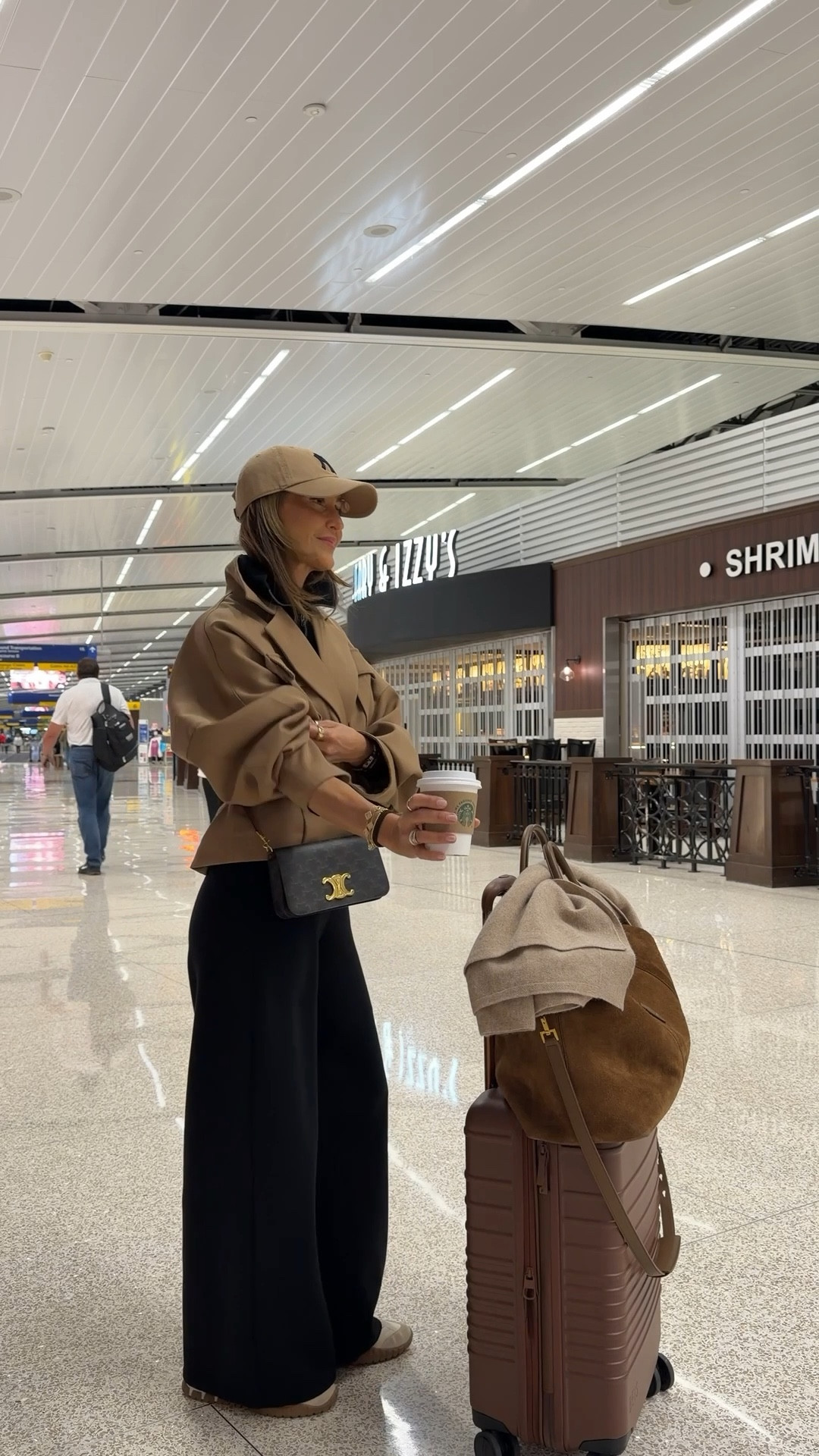 Airport Outfit 🤎✌🏽 to close a full month of travels and celebrate staying put for a while! Comment AIRPORT OUTFIT and I’ll send you links to shop! 

Spanx wide leg and half zip up pullover travel set, crop trench, suede duffel bag, miu miu sneakers, chic travel outfit, airport outfit 

#LTKgrwm #LTKTravel #LTKootd