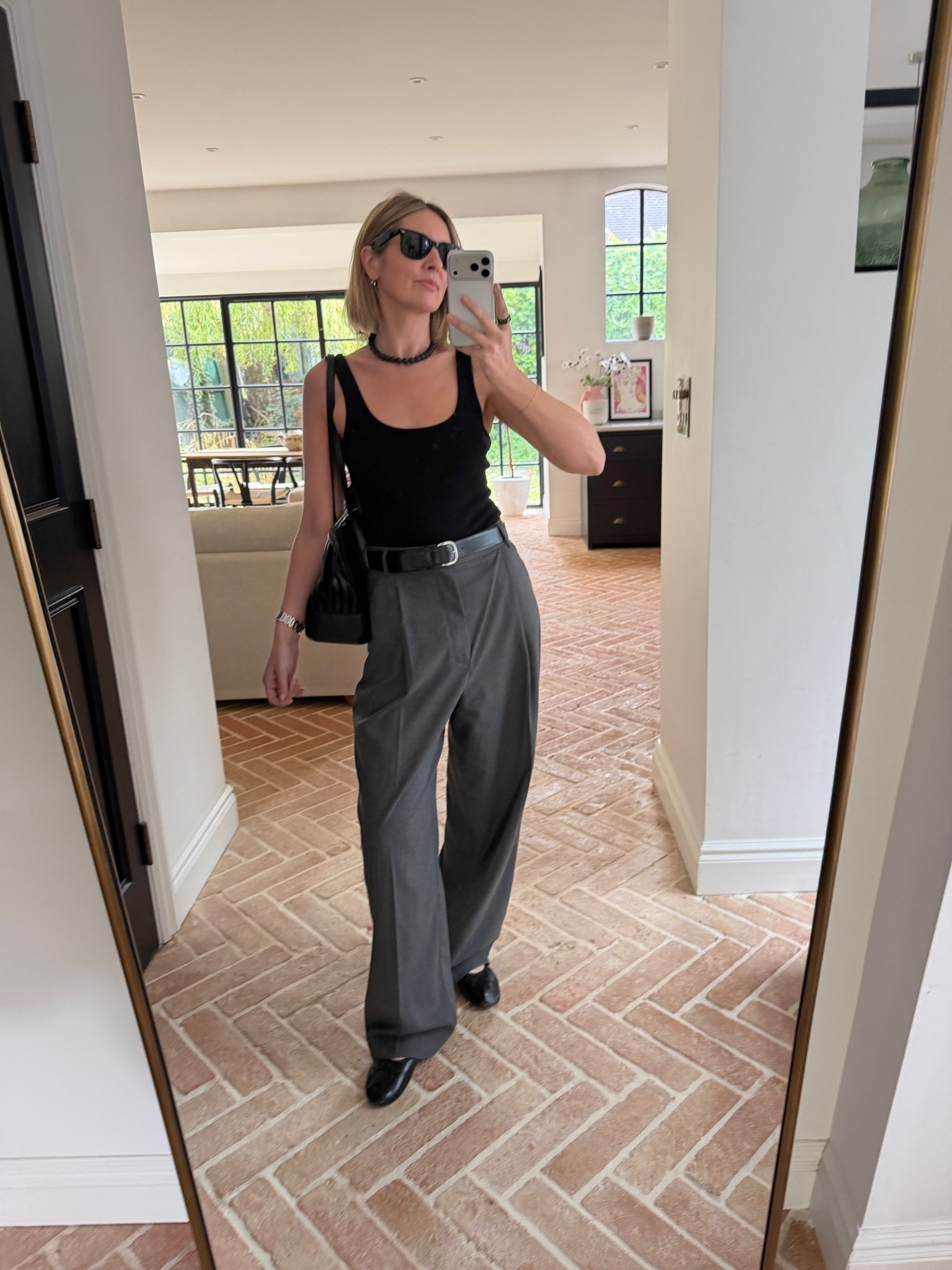 OOTD 🖤

black scoop neck tank, ribbed tank top, grey tailored trousers, wide leg trousers, pleated front trousers, black leather belt, black loafers, black shoulder bag, chain necklace, black cat eye sunglasses, casual chic outfit, office to weekend style, elevated basics, quiet luxury, monochrome styling, neutral color palette, mirror selfie ootd, ltkstyletip, ltkseasonal, ltkfindsunder100, ltkworkwear, ltkitbag

#LTKdatenight #LTKstyletip #LTKworkwear