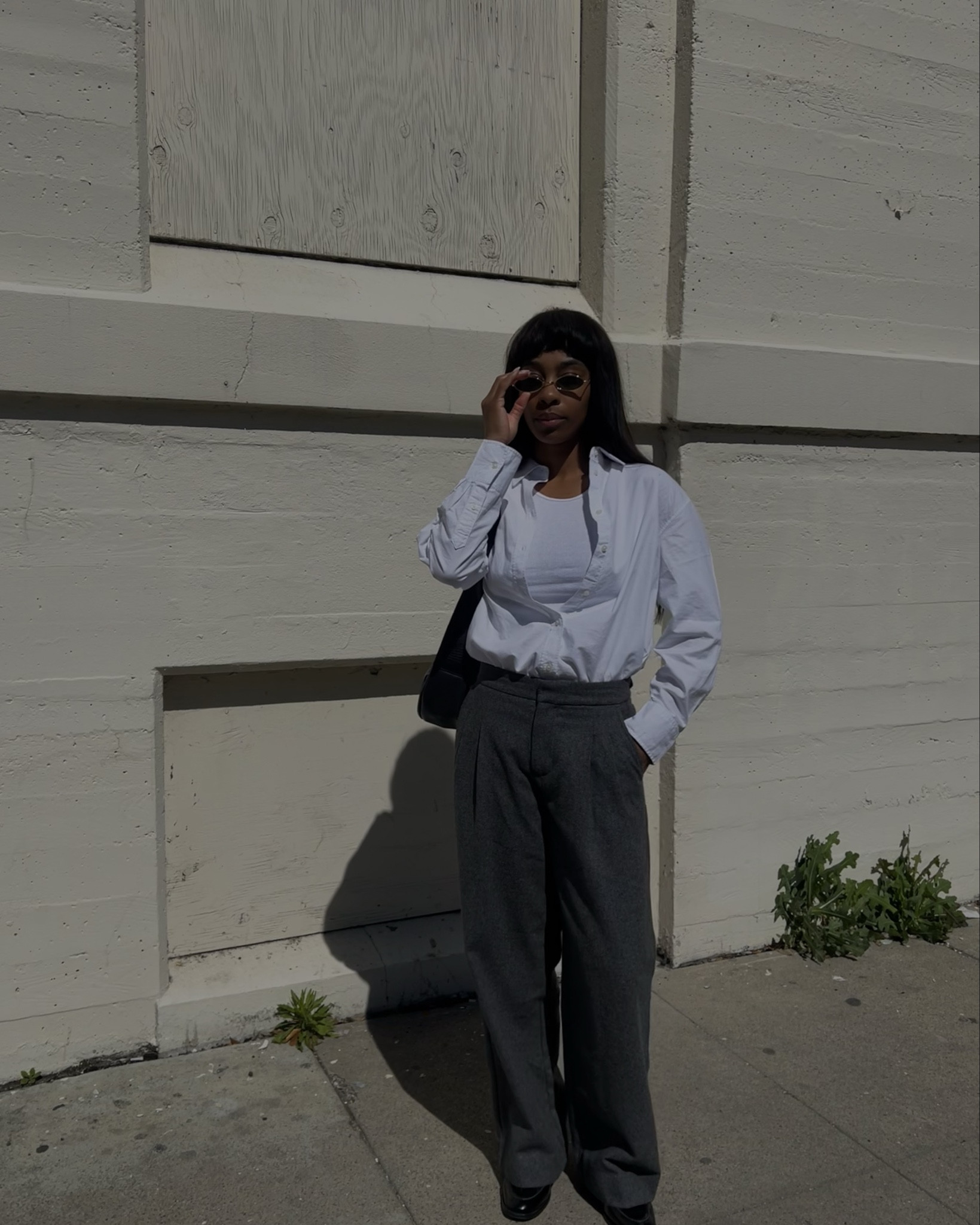 white Oxford shirt, means white tank, grey pants, black loafers, black bag.

#LTKfindsunder50 #LTKitbag #LTKstyletip