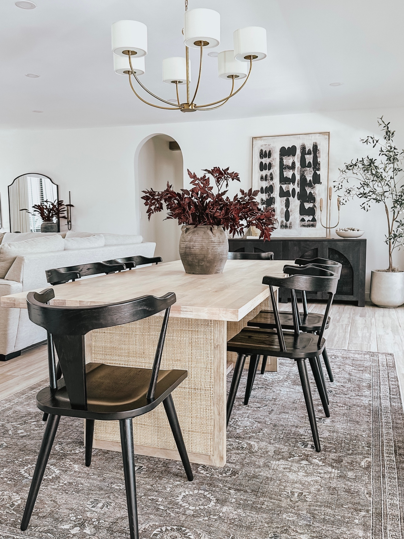 Dining room decor links 🤎 #diningroomtable #diningroomchairs #diningroomdecor #blackdiningchairs #canetable #modernorganicdecor #arearug #loloirug #chandelier #homedecor #neutraldecor #vase #sideboard #wallart #falldecor 

#LTKsalealert #LTKSeasonal #LTKhome