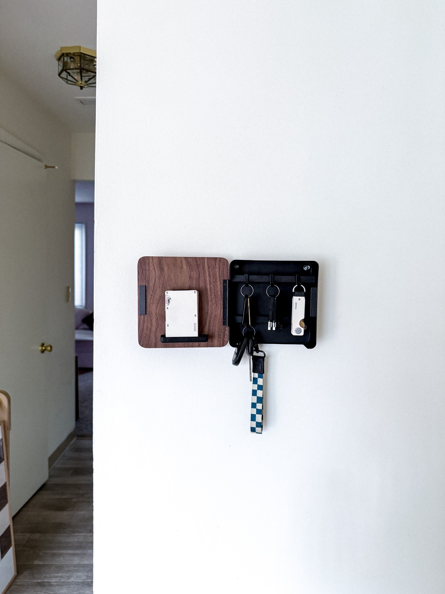 obsessed with my new minimalist key cabinet 🖤 the door is walnut + the rest is steel, and it’s magnetic so you can even hang it on the fridge! 
#keycabinet 

#LTKHome #LTKTravel #LTKFamily