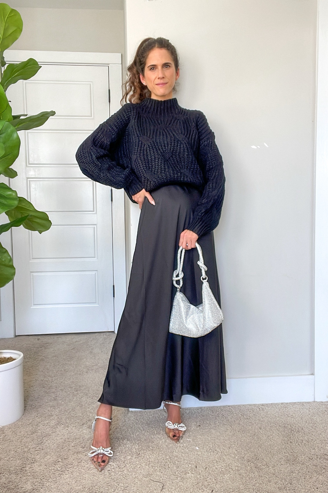 Holiday outfit | Christmas party outfit | New Year’s Eve outfit | date night outfit | black silk maxi skirt | chunky knit sweater | embellished heels | sparkly clutch 

#LTKsalealert #LTKshoecrush #LTKstyletip