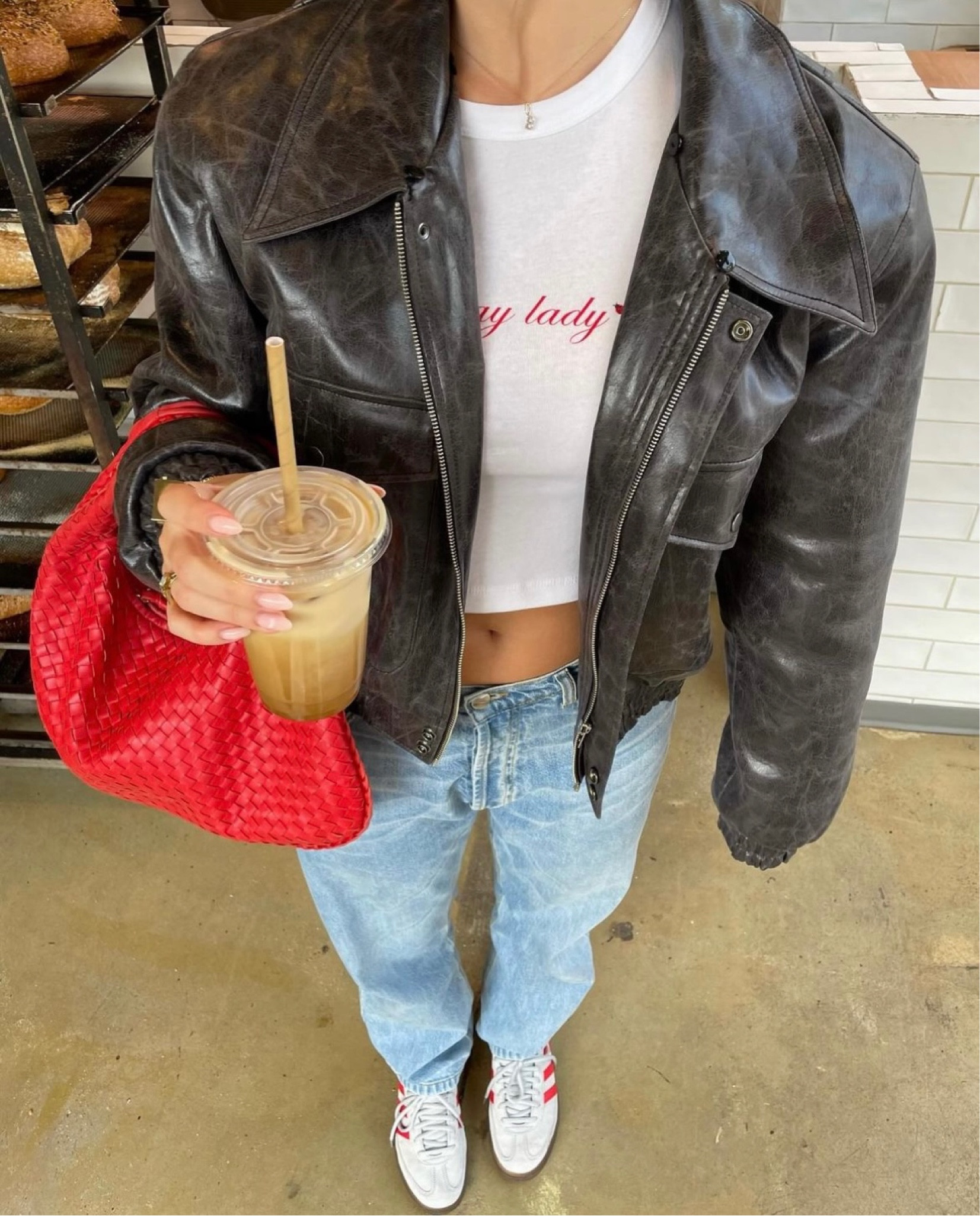 Spring casual outfit 

Oversized Leather jacket
Blue boyfriend jeans 
Red bottega bag
Red shoes 
Graphic tee  
#springoutfit #boyfriendjeans #redbag #adidassamba

#LTKSeasonal