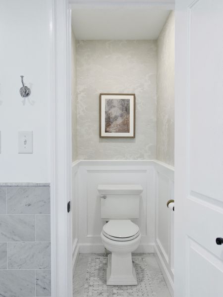 During the remodel I decided to incorporate a water closet. It is narrow but perfectly functional.  The wallpaper is from McGee and Co and the framed art from Target 

#LTKstyletip #LTKFind #LTKhome