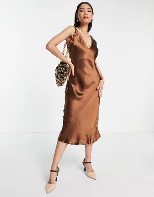 ASOS DESIGN bias cut satin midi slip dress with soft v neckline detail in brown | ASOS (Global)
