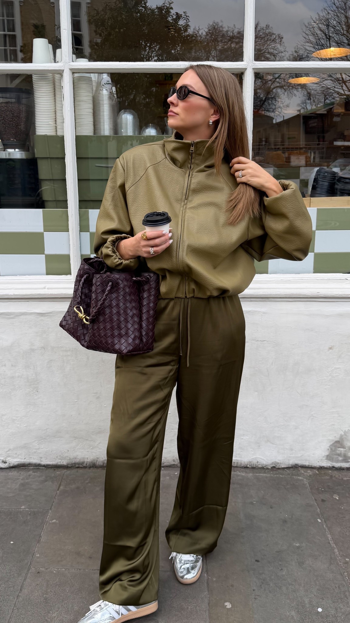 Head to toe green 
Couture club green jacket 
Abercrombie silky pants 
Silver adidas sambas 
Bottega bag 