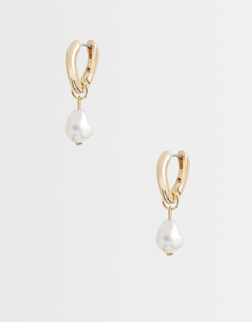 ASOS DESIGN huggie hoop earrings with faux freshwater pearl drop in gold tone | ASOS (Global)