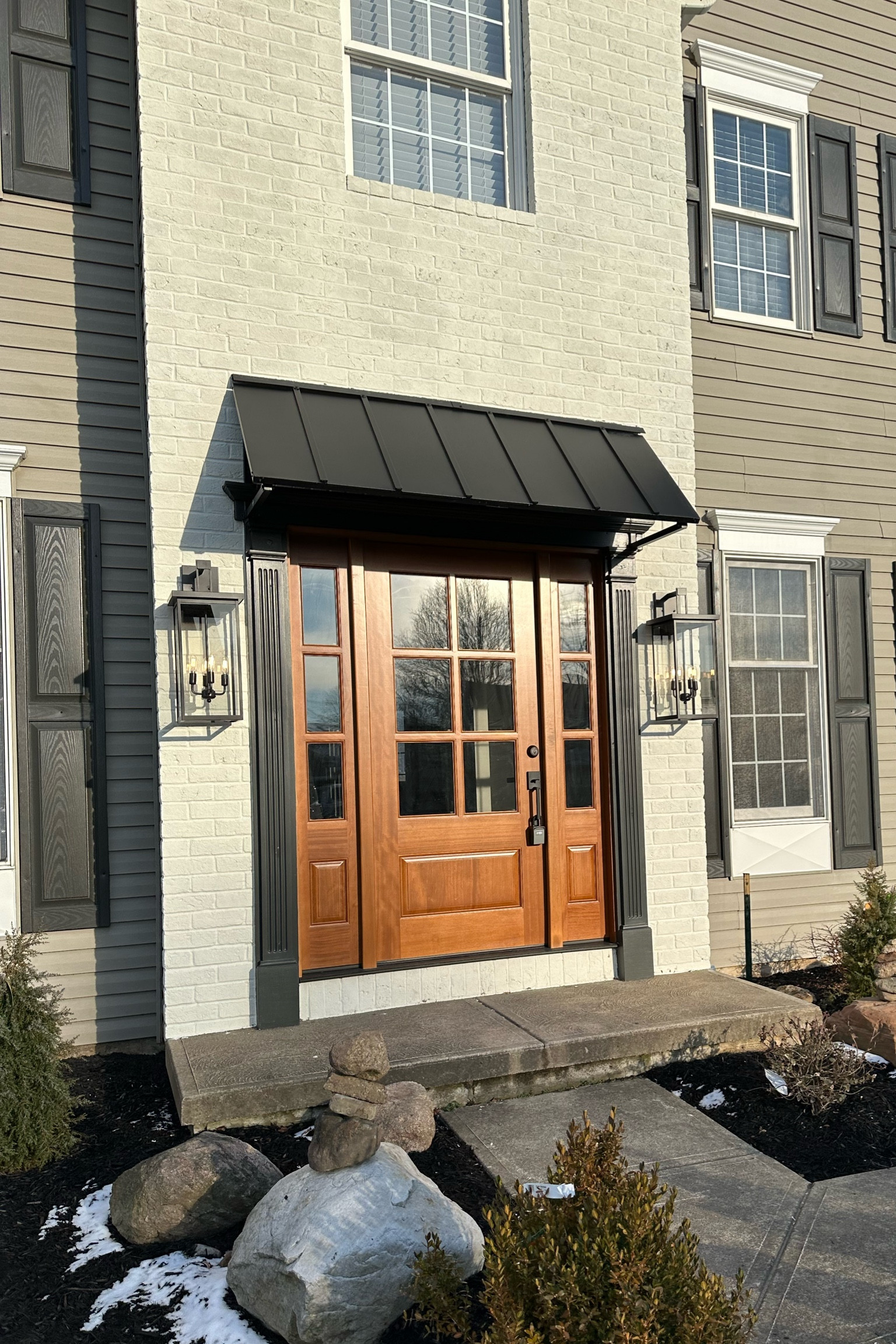 These lights and awning made such an impact on the front of this house we remodeled. All affordable and changed the look drastically. When doing outdoor lights I recommend going BIG :) 
The front door is really great quality and helped to really change the look and modernize the whole hose. Everyone loves the front door and metal awning 

#LTKHome