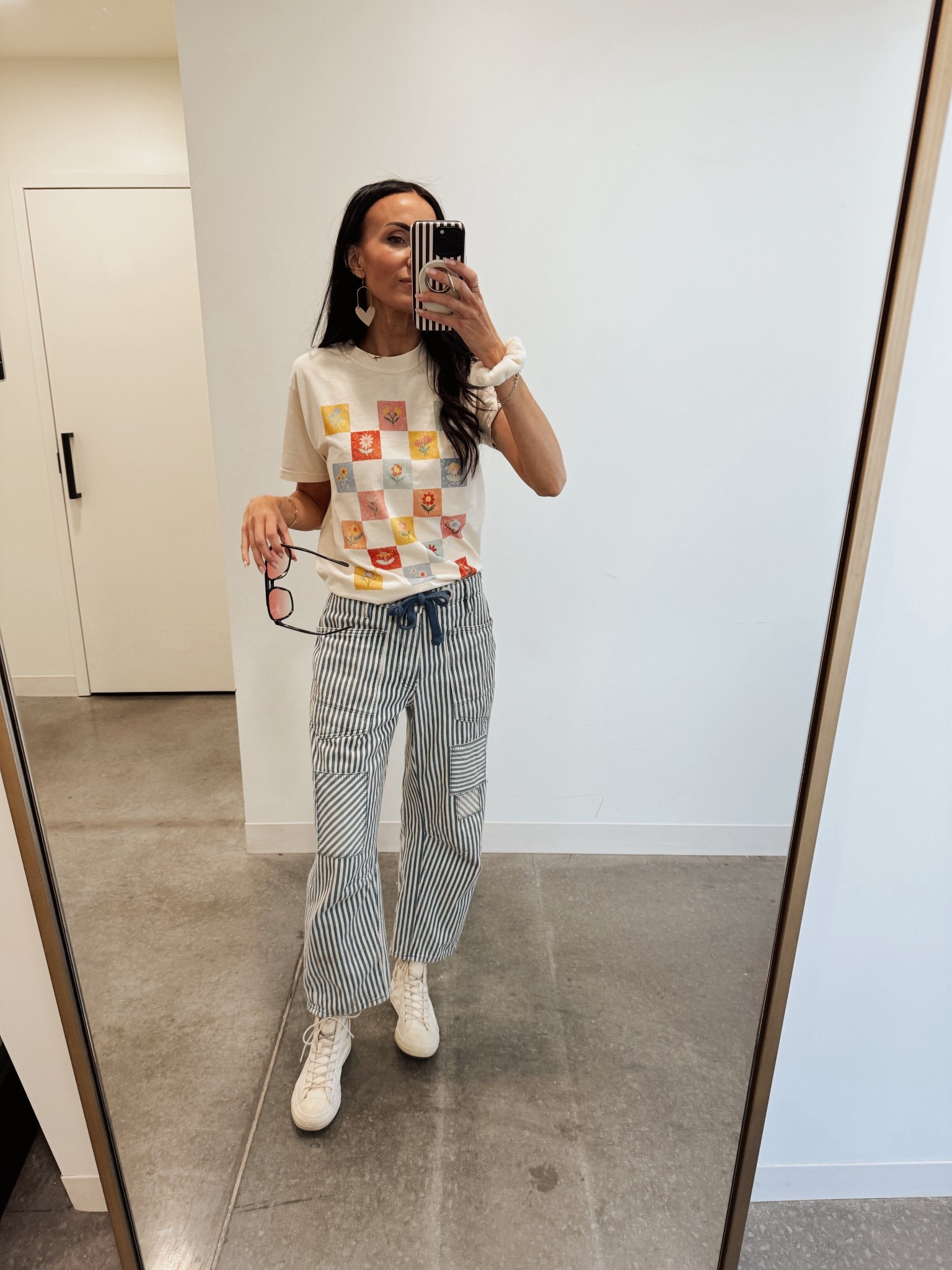 Dressing for the season I want. Super cute graphic tee pairs well with so many earrings. @Mountain Moverz 