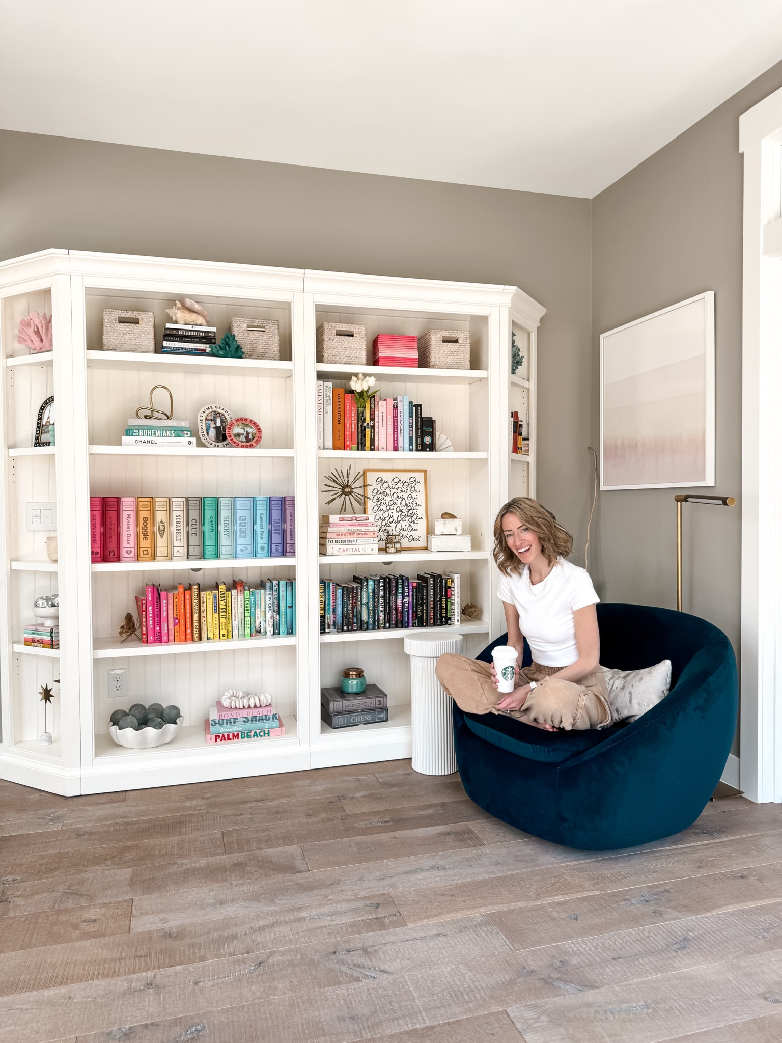 Home decor and styling white Aubrey bookcase, bookshelves shelf styling for spring and summer colorful home decor, rainbow home, decor, books, book stack, things to read