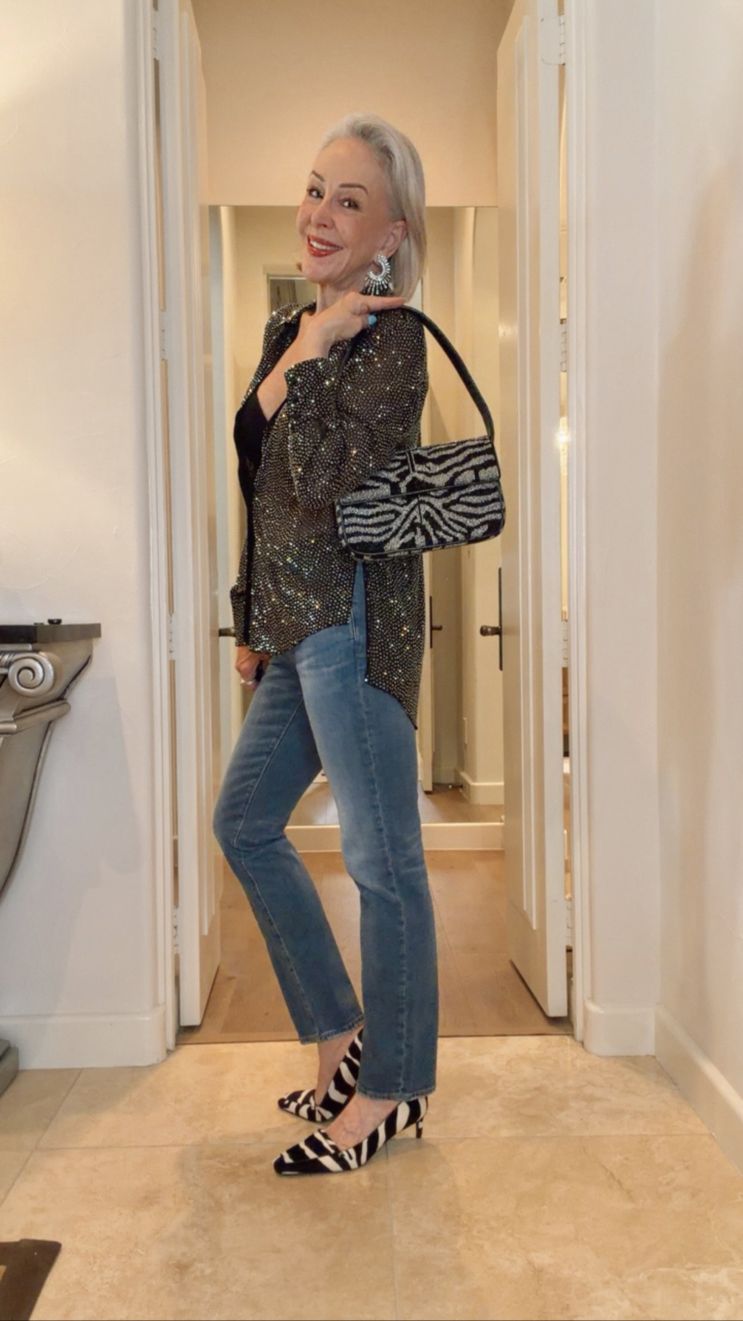 Nordstrom Sale
Alice & Olivia black sheer embellished blouse, beaded zebra print bag by Staud, AG Jeans, Khaite zebra print low heeled pumps, Wacoal strapless Red Carpet bra.

#LTKOver40 #LTKSaleAlert #LTKgrwm