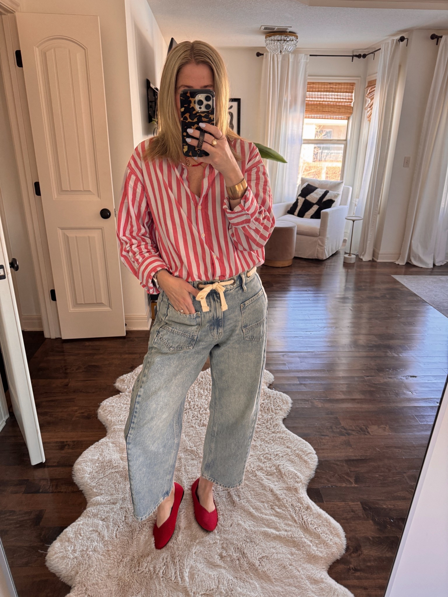 Striped shirt, red flats, barrel jeans with tie, red beaded necklace 

#LTKValentine #LTKOver40