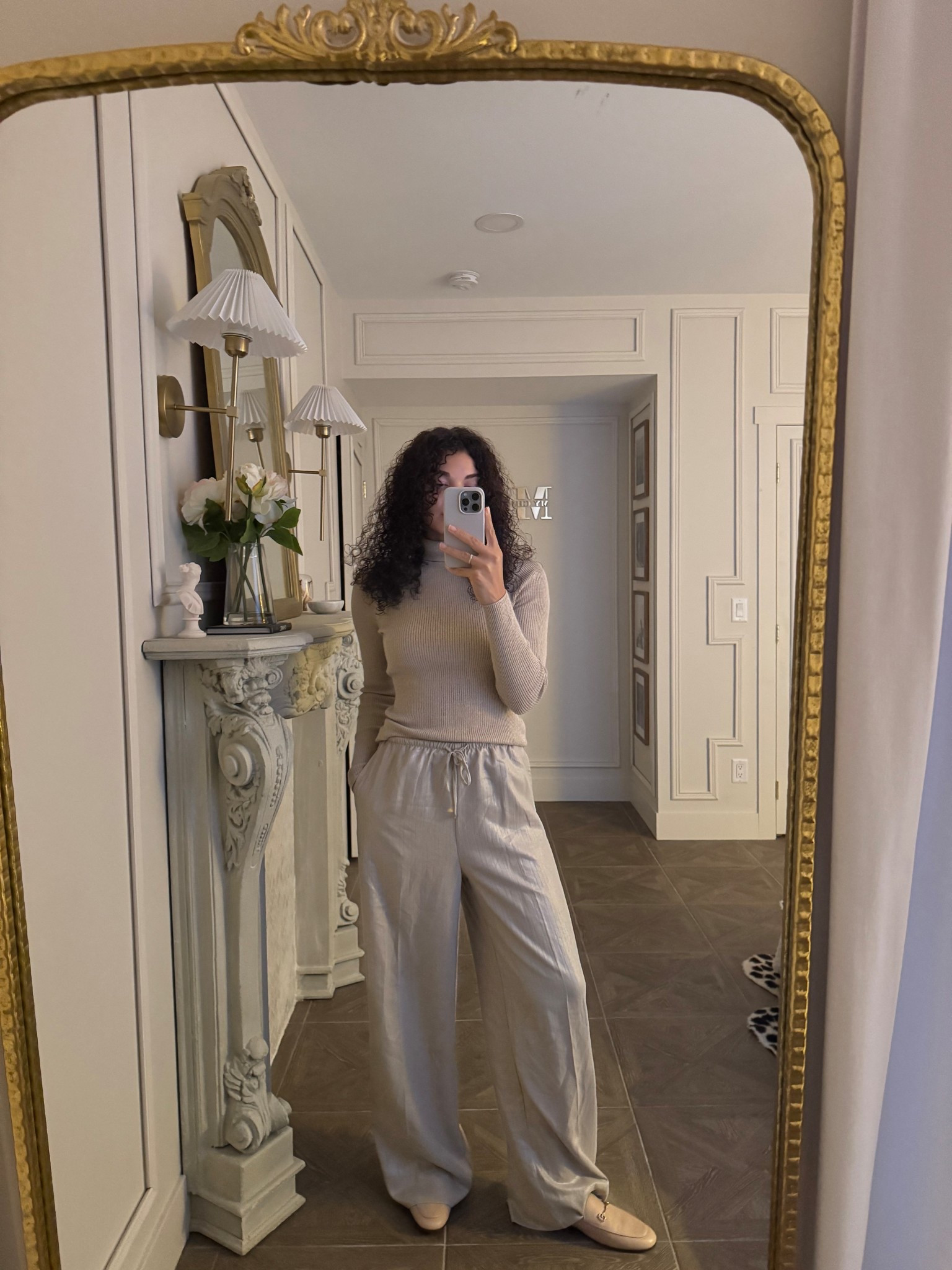 Chic yet comfortable holiday outfit: a gold lurex turtleneck, gold metallic shimmer wide leg pants with an elastic waist, and loafers. Top off the outfit with a faux fur coat 

#LTKHoliday