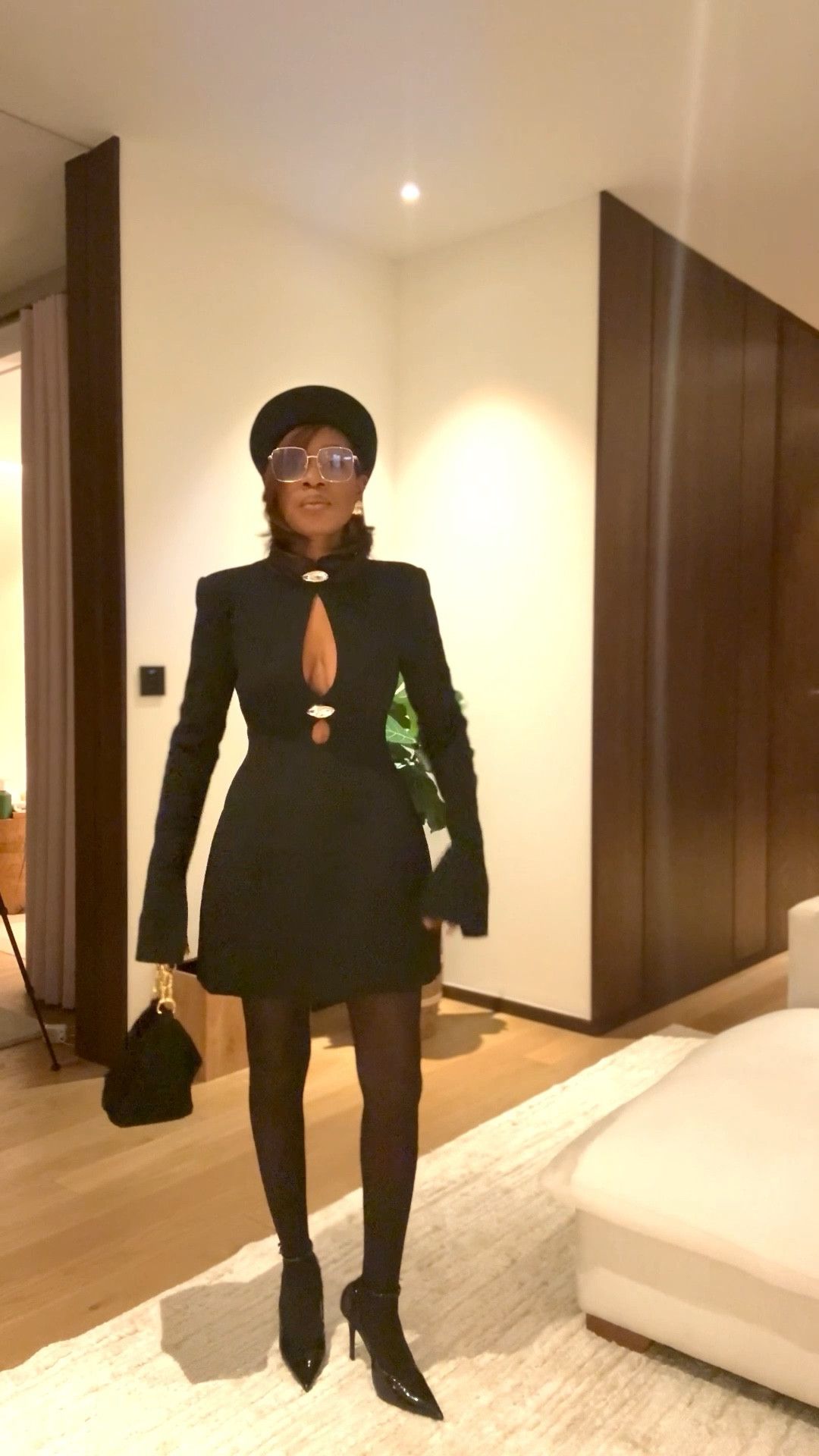 Dinner outfit. Black cut out dress with hourglass shape, black pillbox hat

#LTKootd