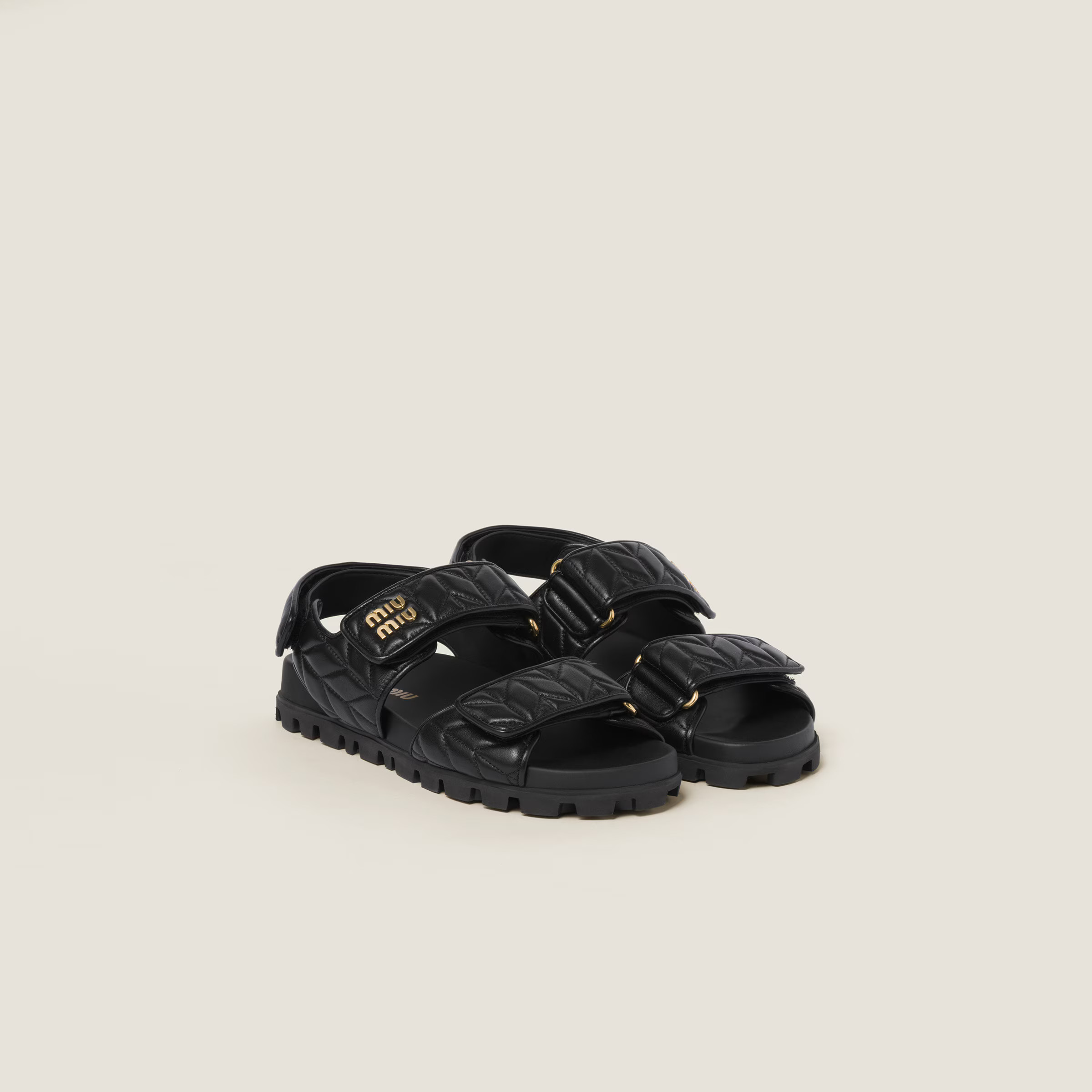 Black Sporty Matelassé Nappa Leather Sandals | Miu Miu | Miu Miu US