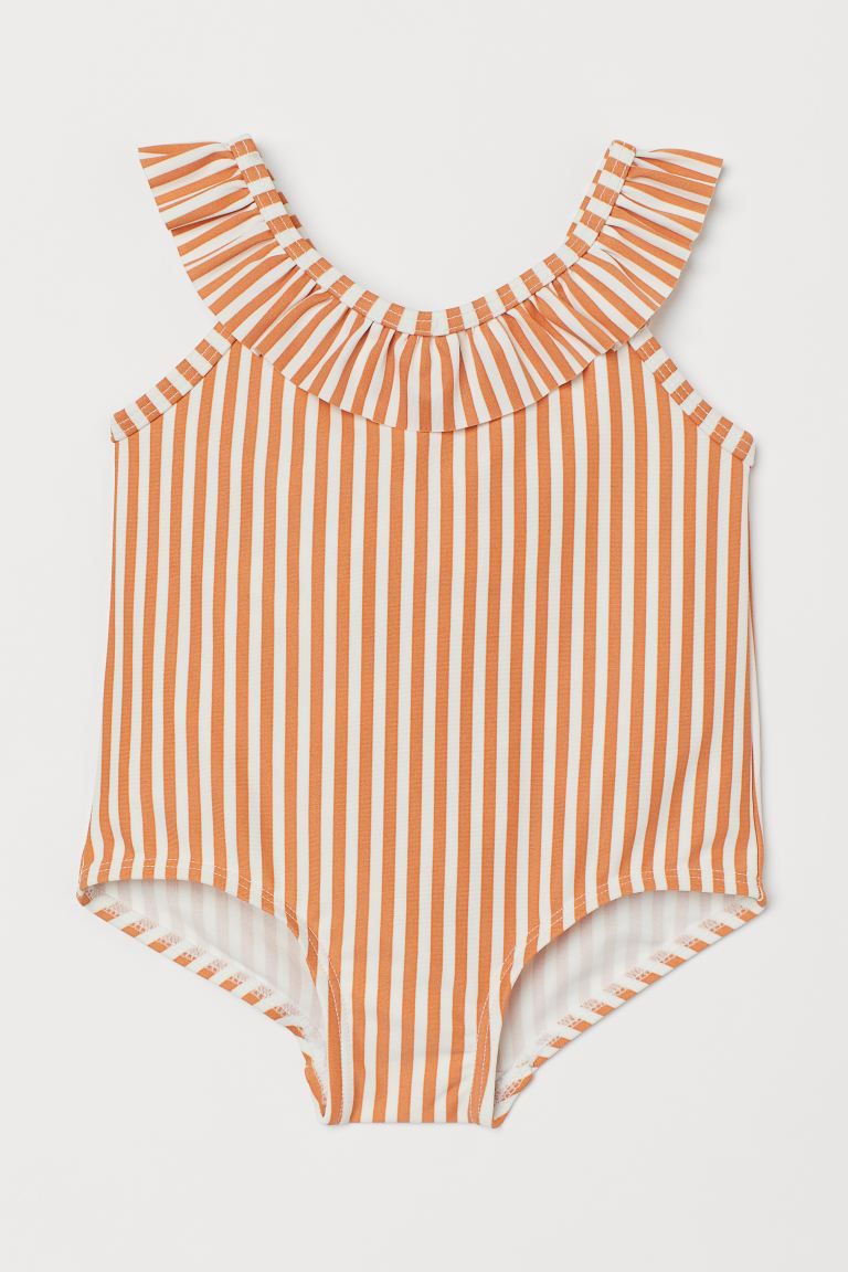 Swimsuit with a printed pattern. Ruffle-trimmed neckline and shoulder straps, bow at back, and li... | H&M (US)