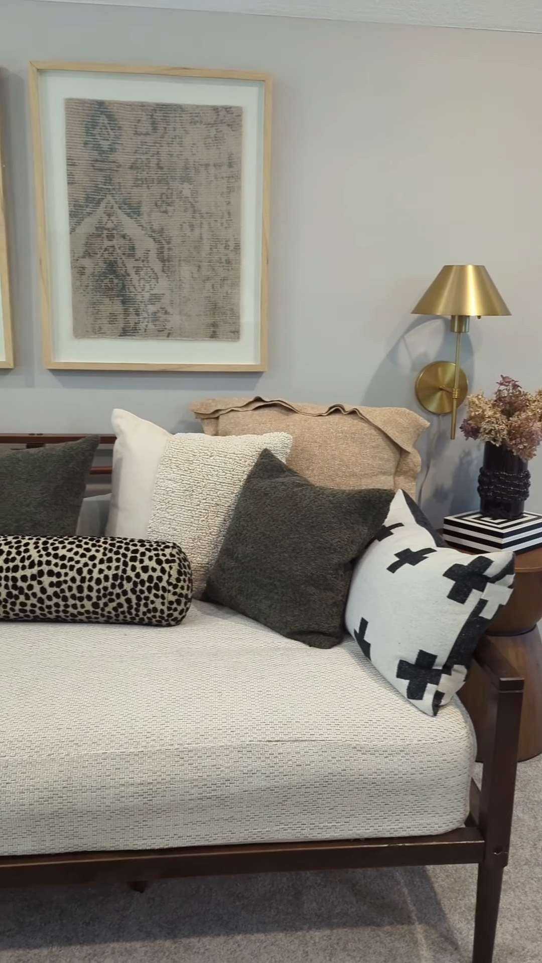 The loft daybed — the zippered upholstery fabric mattress cover gives it more of a sofa feel. Layered pillows in warm neutrals and greens, velvet curtains, and tapestry art add to the cozy vibe. The green ottoman was a lucky Facebook Marketplace find — I added tall metal legs for extra height and style.
#LoftDecor #Daybed #daybedcover 

 #LTKHome #LTKFindsUnder50 #LTKFindsUnder100