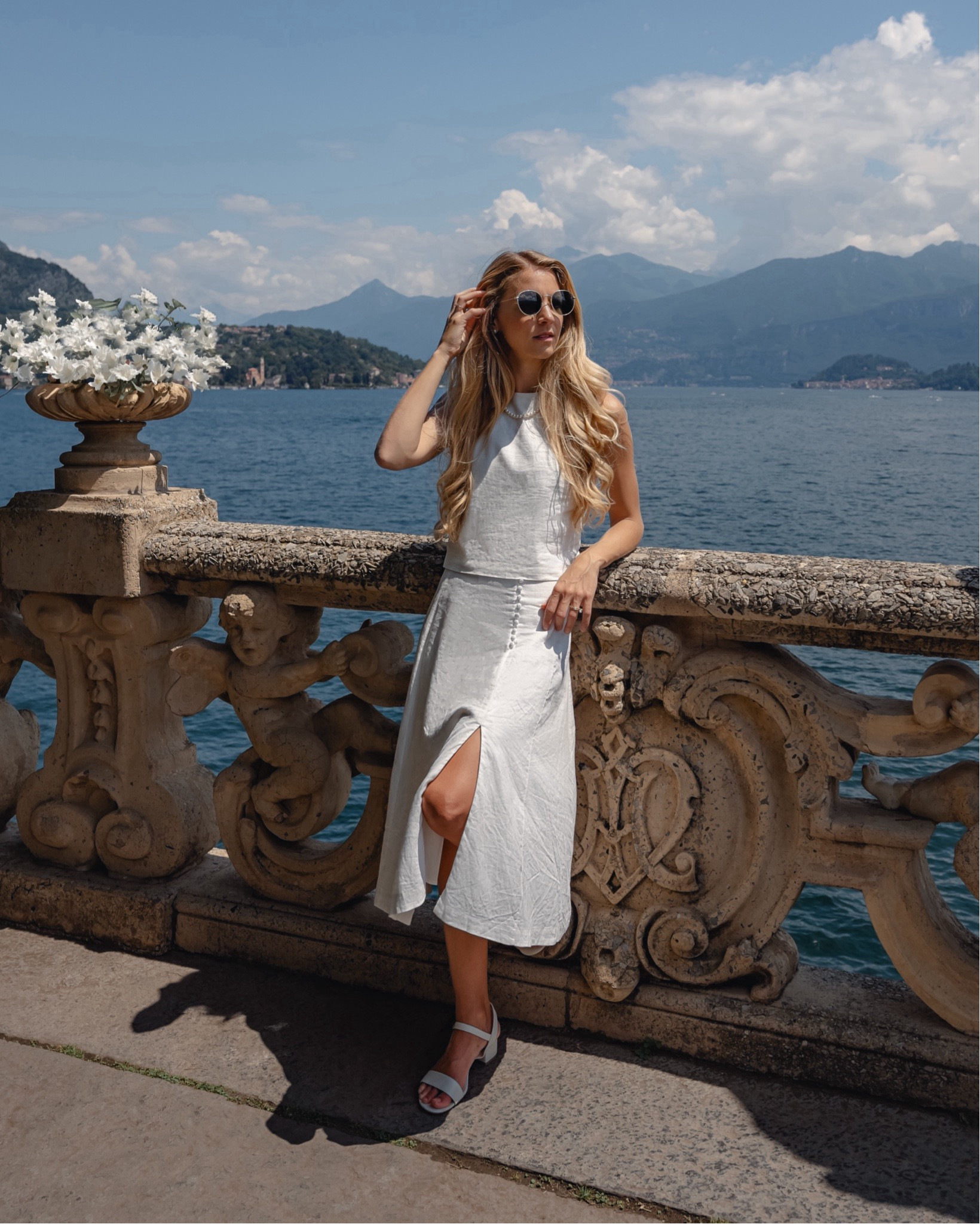 The perfect outfit for summer! Linen is always my go to and this set can be dressed up with a block heel or down with sneakers.

It's perfect from brunch, sight seeing, the farmers market, a day on the boat pair with a cute bikini and so much more.

It's so versatile and classic.

Vacation outfit - linen skirt, linen top, nisolo block heels, Lake Como, spring dress, spring outfit, summer style, summer dress, linen outfit, white outfit, white skirt, white dress, white heeled sandals, classic style, European style, European summer, summer abroad, travel outfits, Europe outfits, summer travels, what to wear in Europe, what to wear in Italy, what to pack for Europe, summer style, summer vacation, vacation outfits, little white dress, co-ord set, matching set, white outfit, monochrome outfit

#LTKStyleTip #LTKTravel #LTKFindsUnder100