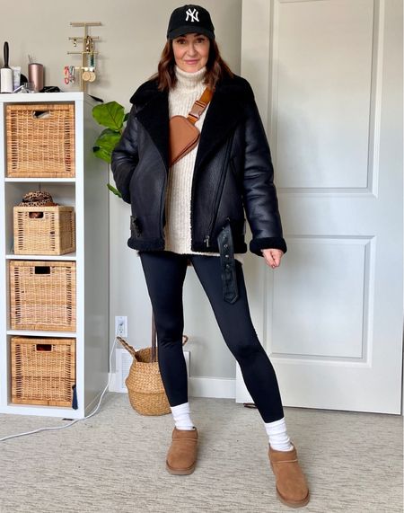 Casual and warm leggings outfit… my shearling moto jacket is 30% off! Fits tts, I’m 5’ 7” wearing small. I also linked a similar from Amazon that’s also cute and good quality.
My Amazon fleece lined leggings are also on sale (fit tts) and my long turtleneck sweater is from Old Navy so it’s probably on sale too! I sized up to M for an oversized fit. 
My belt bag, sweater slip, cap and socks are also from Amazon. I linked my ultra mini Uggs are several retailers but I think most sizes are sold out 
Grey hoodie from the beginning of the video is from Amazon and fits tts, joggers are H&M but older 


#LTKitbag #LTKSeasonal #LTKstyletip