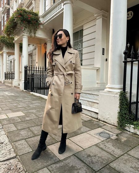 Kat Jamieson wears a trench coat in London. Over the knee boots, leggings, fall boots, fall outfit, neutrals.

#LTKtravel #LTKshoecrush #LTKSeasonal