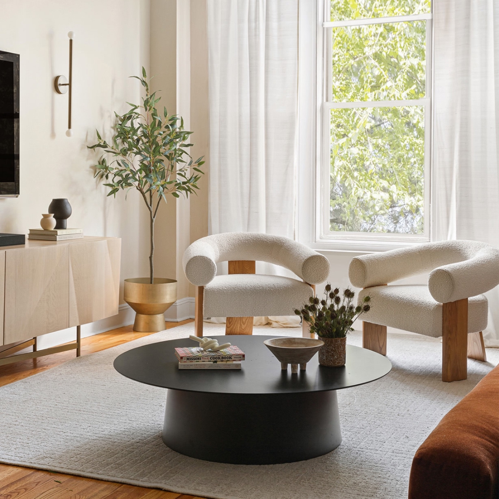 Don’t you love our use of warm neutrals? It really maximizes the natural light. One of our favorite things is that ALL of these pieces are super functional. The #bouclechairs are SO comfy, the #coffeetable has a ton of surface area and is sturdy, and the silk #curtains perfectly filter the light 🤍

#LTKover40 #LTKMostLoved #LTKhome