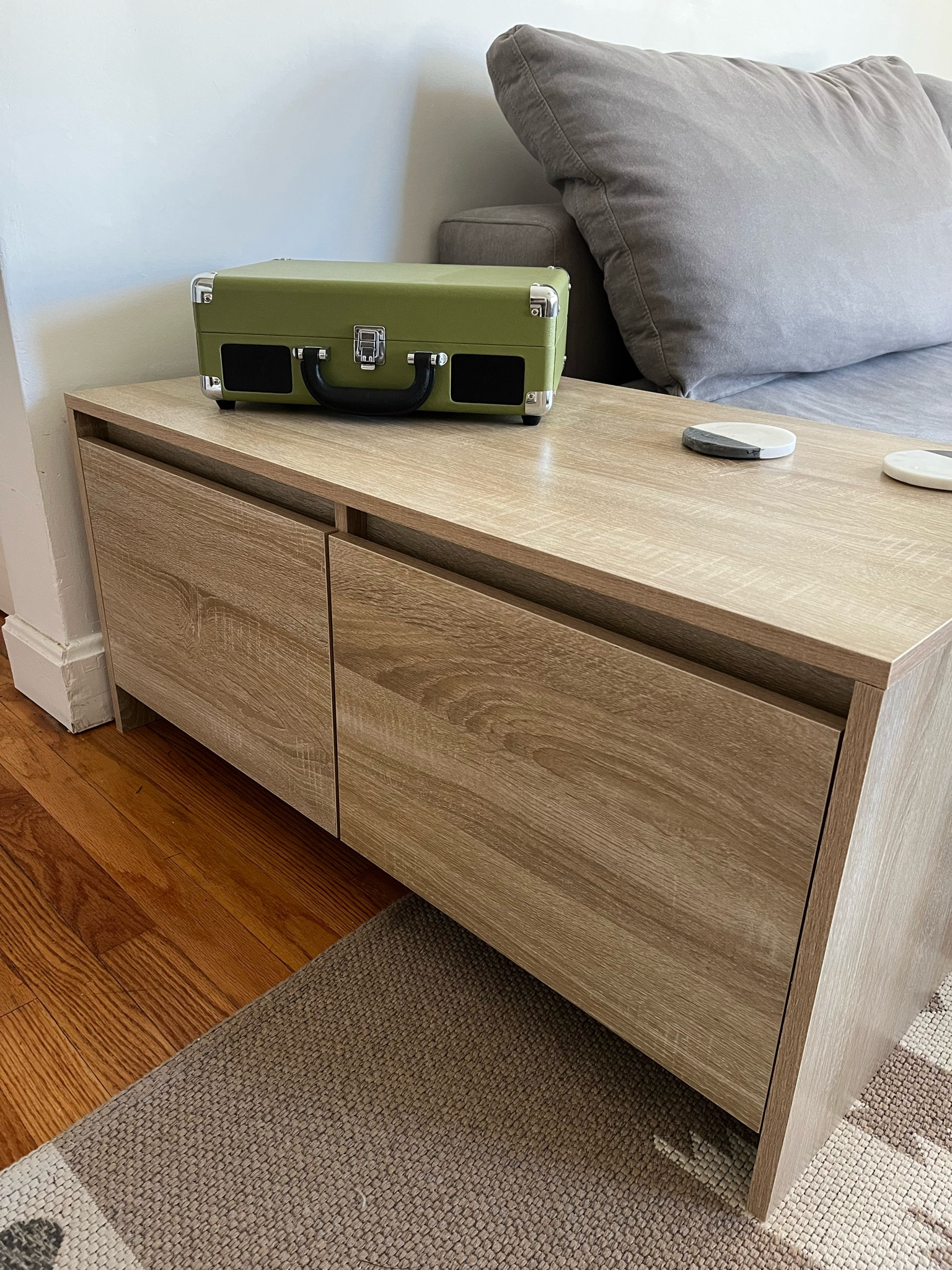 In LOVE with our new end table + with our cutie new record player too 🎶

Pros: 

💚 No filter in only natural light to show true finish! The color is perfection + the wood texture looks so real. It’s a great natural white oak alternative. 

💚 A complete steal at $134! 

💚 True size: 35-7/16”W x 19-13/16”D x 16-5/16”H [trust me.. measuring things is my job] 

💚 An end table with storage was a must in our tiny living room. I love love love these drawers. 

💚 It is technically a coffee table which means all sides are finished + beautiful! 

💚 See more angles of this piece on my feed! 

Cons: 

1️⃣ It took a long time to assemble. 

2️⃣ We knew this going in, but the finish is not super durable. Our first shipment had some damage, so we needed to exchange it for another. But since then, no sign of wear + tear at all! 

All in all, both cons were 100% worth the extremely affordable price. We are so happy with it + it really levels up our space ✨ 

coffee table with drawers, sled coffee table drawers, affordable white oak coffee table, white oak veneer, modern white oak coffee table, modern coffee table storage, rectangular coffee table storage, latitude run Sonoma oak, latitude run coffee table white chipboard, vidaxl coffee table Sonoma oak, vidaxl coffee table drawers, 3’ coffee table, 36” coffee table, small living room coffee table, small living room ideas, minimal coffee table, minimalist coffee table, minimalistic coffee table, minimalism coffee table

#LTKFind #LTKhome