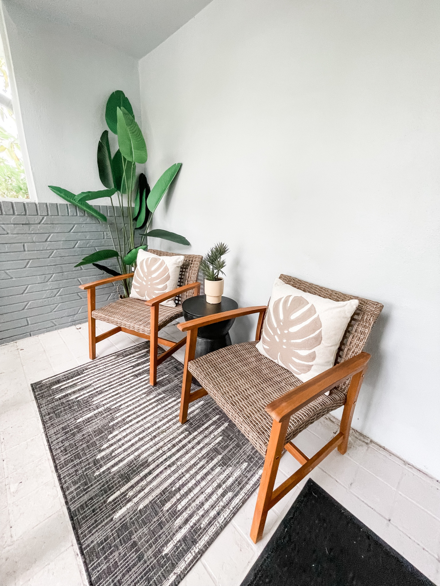 Porch- Grey design Rug, wooden chairs and floor plant 

#LTKHome