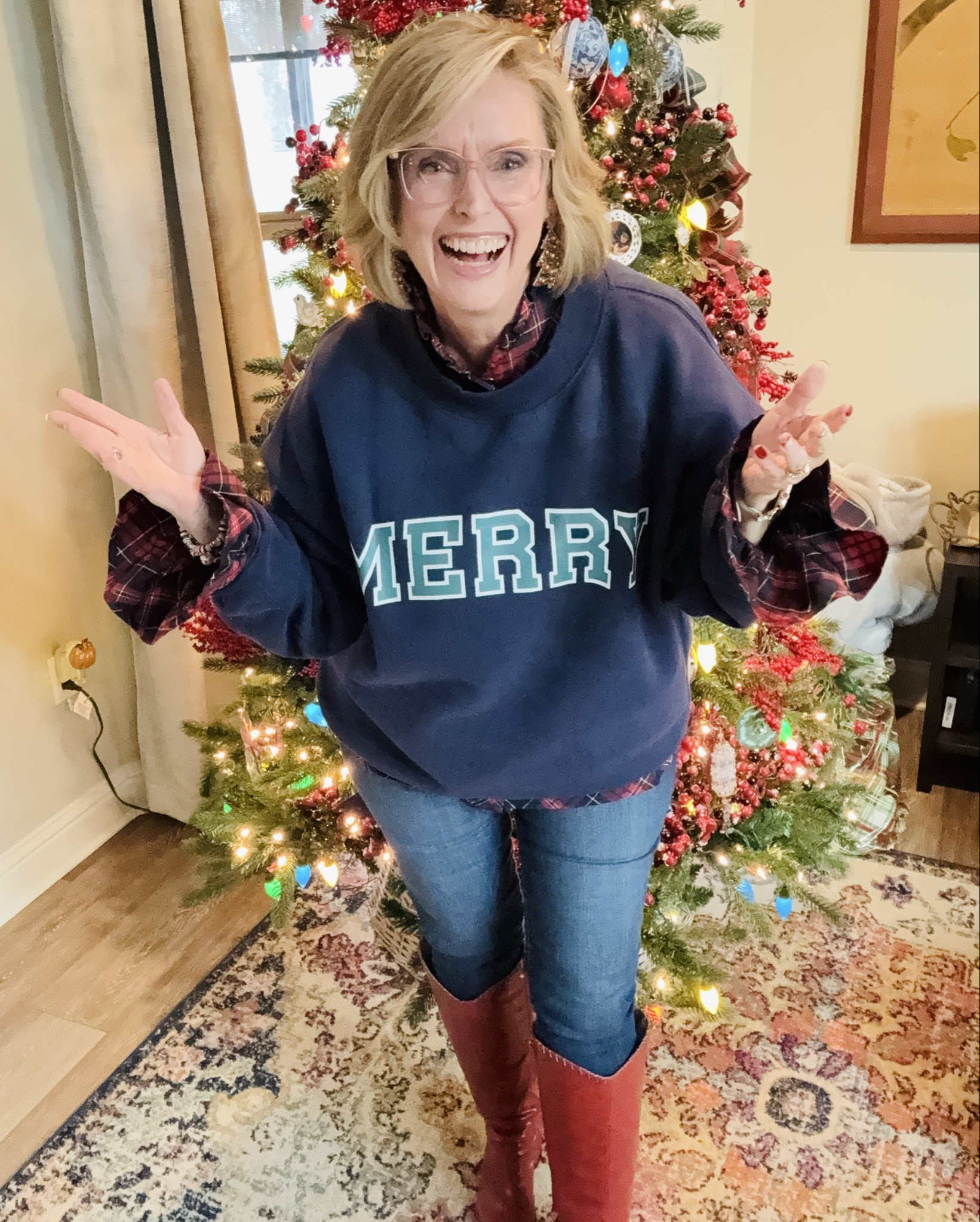 Have yourself a merry little Christmas!

Stay comfy and cute this season by layering a sweatshirt over a plaid top like I did here. Instantly elevates the look! 

#LTKMidsize #LTKHoliday