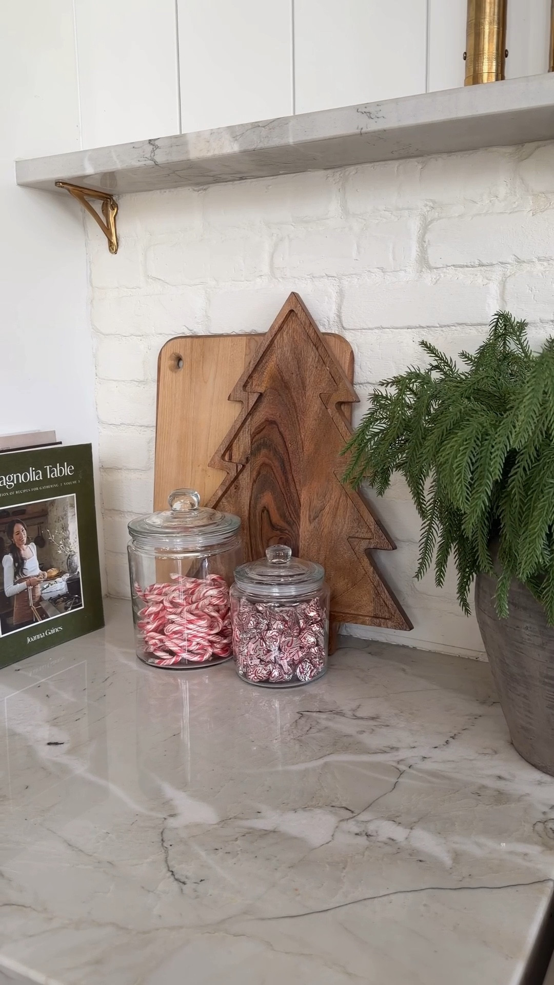 Give me 30 seconds, a few glass canisters, and some festive treats… and suddenly the kitchen feels like Christmas 🎄✨

Fill them with mini candy canes, white chocolate kisses — or anything you love. They’re under $7 and double as the cutest hostess gift idea (just add a ribbon!).

Paired with this $20 Christmas tree board, it’s such an easy, affordable way to bring a little holiday magic to your kitchen. ✨

holiday kitchen decor, christmas kitchen ideas, easy holiday decorating, christmas kitchen styling, affordable holiday decor, festive kitchen inspo, simple christmas decorations, holiday home ideas, at home, charcuterie board, holiday hosting, candy cane, gift guide, gift idea, hostess gift 

#LTKFindsUnder50 #LTKGiftGuide #LTKHoliday