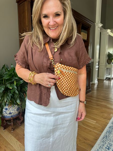 Love this grande Fanny ClareV bag. Do you need a Mother’s Day happy? You’ll love it. I think this tan and white woven is the best color for summer and fall! So chic. 

Blouse size 12
Skirt size large short 

Abercrombie JCREW sling bag 

#LTKover40 #LTKitbag #LTKtravel