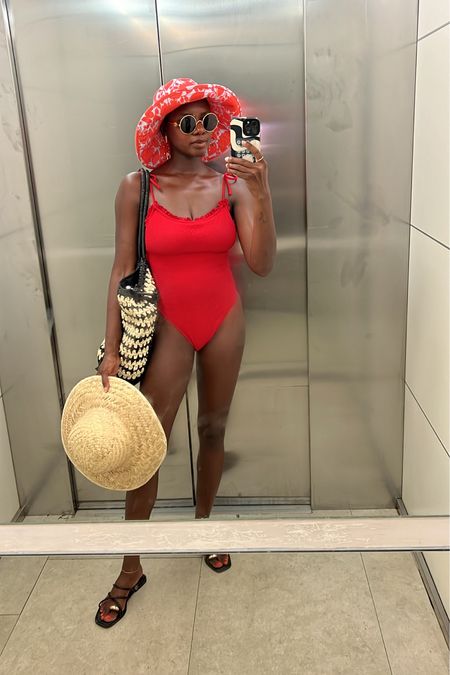 Vacation outfits! Red one piece swimsuit, gold sun earrings, packable straw tote bag and black strappy sandals with gold toe detail  

#LTKSwim #LTKTravel #LTKShoeCrush