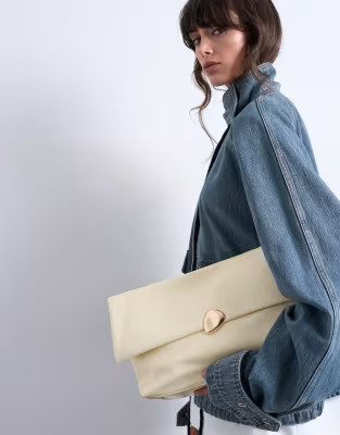 Topshop Gaia folded clutch with hardware in buttermilk yellow | ASOS (Global)