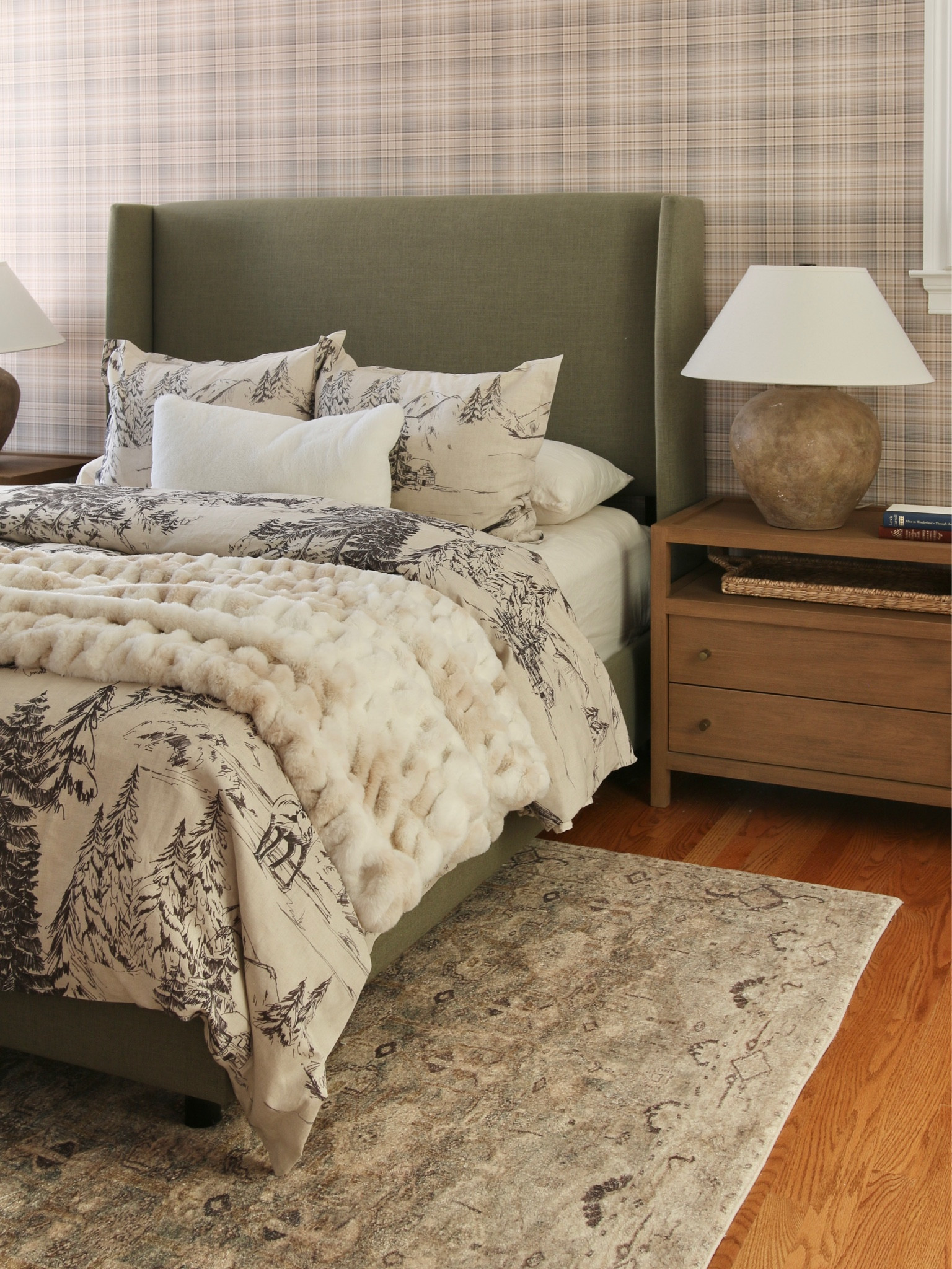 My current view. I kept the low profile upholstered bed, ceramic textured lamp and 2 drawer wood nightstand. 
I add a rustic forest duvet cover and faux fur throw blanket  

#LTKhome #LTKFind #LTKstyletip